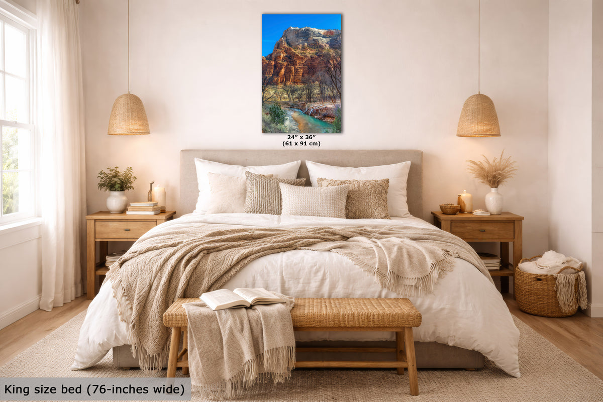A bedroom mockup featuring a vertical canvas print of a red rock canyon landscape with a river, hung above a bed. The image includes text overlays indicating the canvas size (24 x 36 inches) and the bed size (king size bed, 76 inches wide).