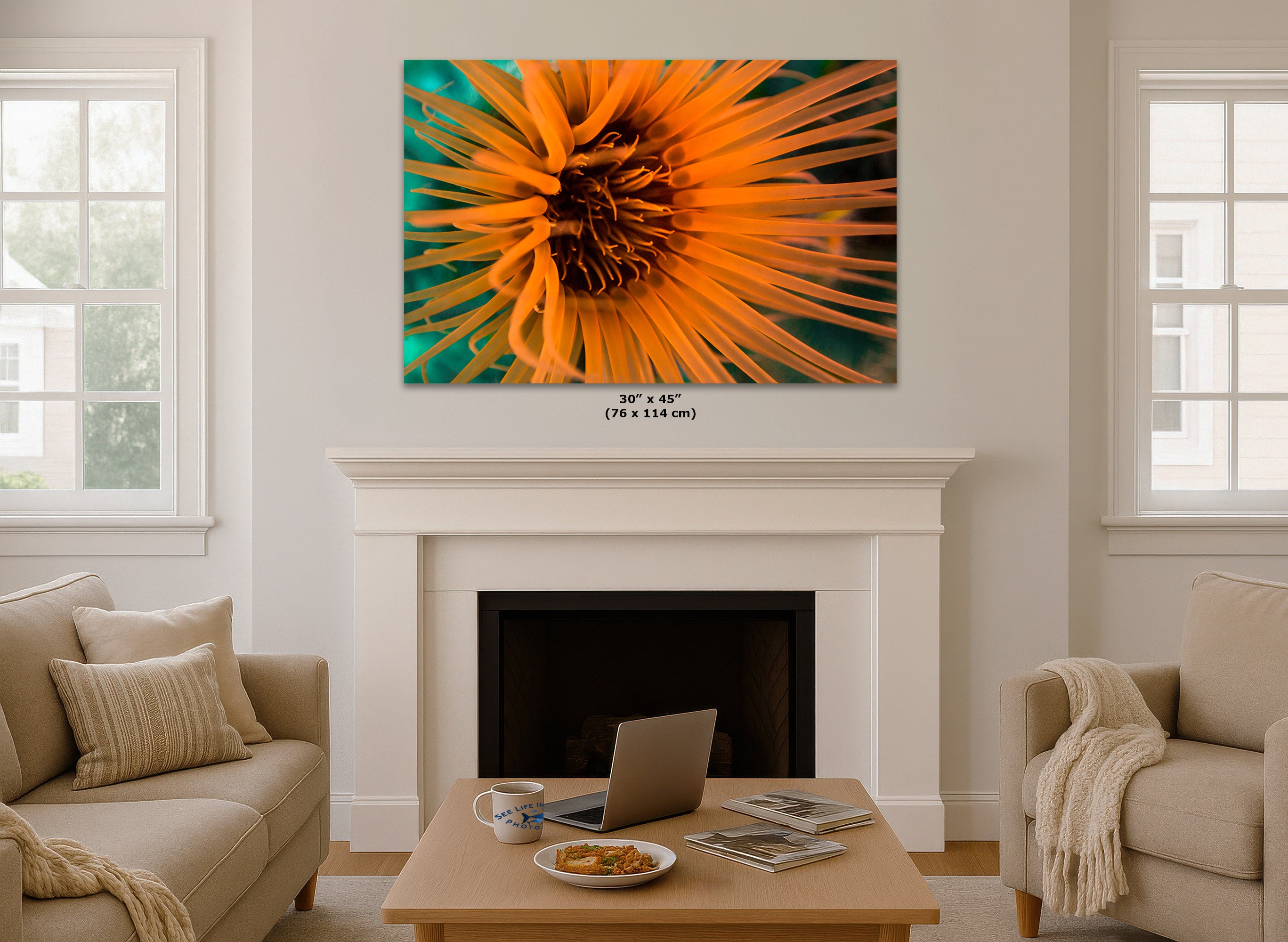 A large square wall art print displayed above a white fireplace mantel in a bright living room. Small text below the print reads 36 x 45 (76 x 114 in).