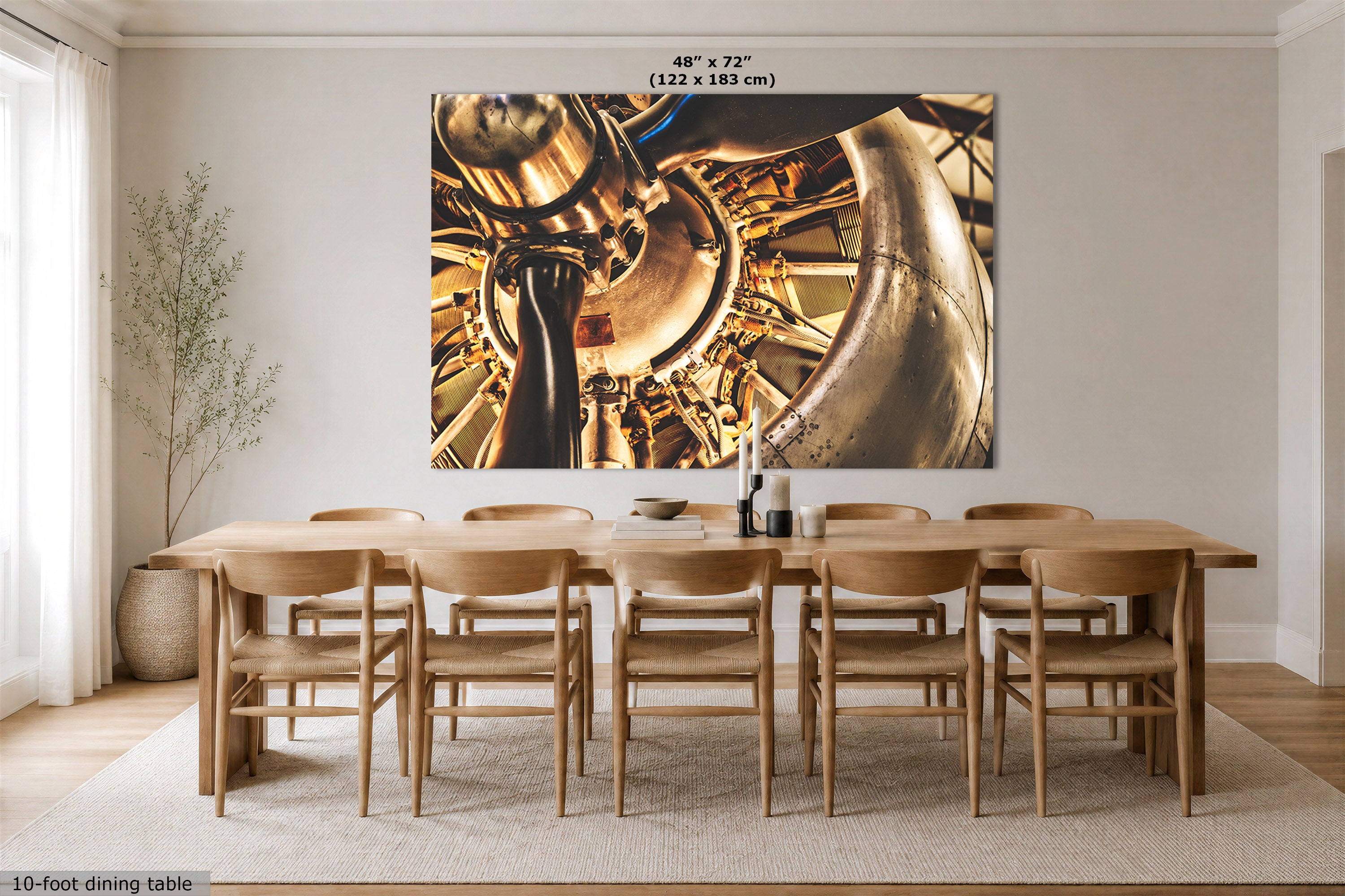 A large vintage airplane engine wall art print showing an airplane engine, displayed above a wooden dining table and chairs in a bright dining room. The print includes size text at the top reading 48" x 72" (122 x 183 cm).