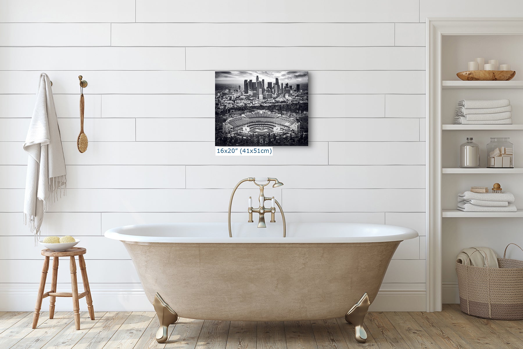 16x20 inch black and white print of Dodger Stadium and the Los Angeles skyline hung above a clawfoot bathtub, monochrome baseball wall art