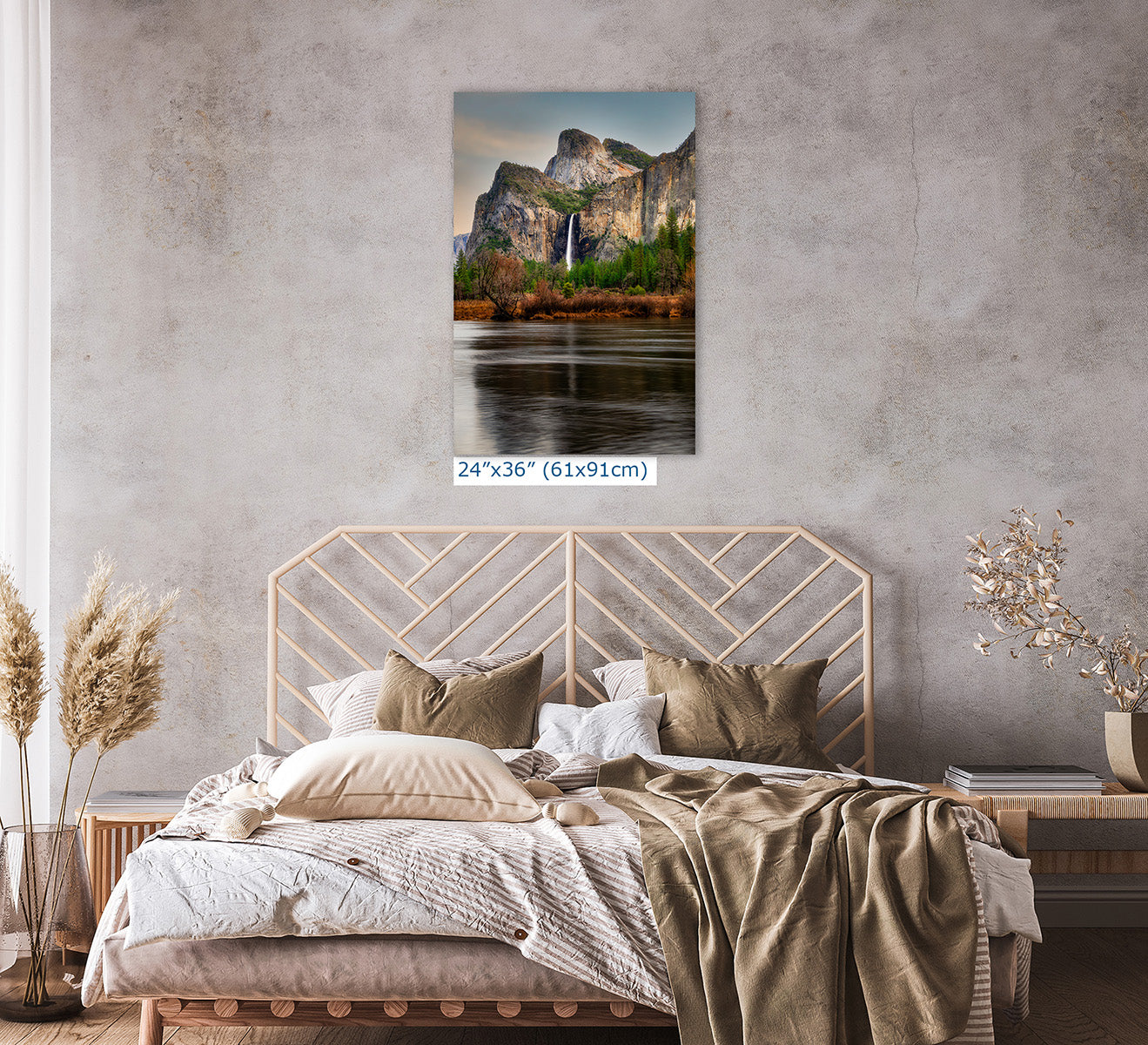 24x36 inch fine art nature photography print of Yosemite Valley hung above a modern bedroom with neutral textiles