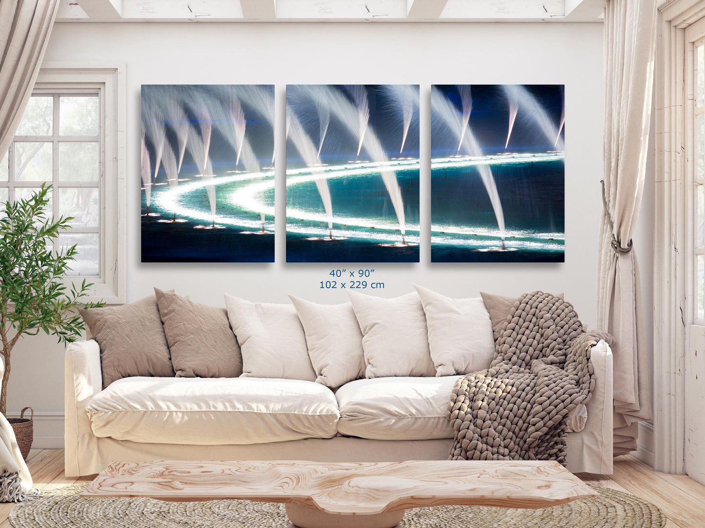 Abstract water fountains at Bellagio, Las Vegas on a 40x90-inch triptych canvas displayed in a spacious living room.