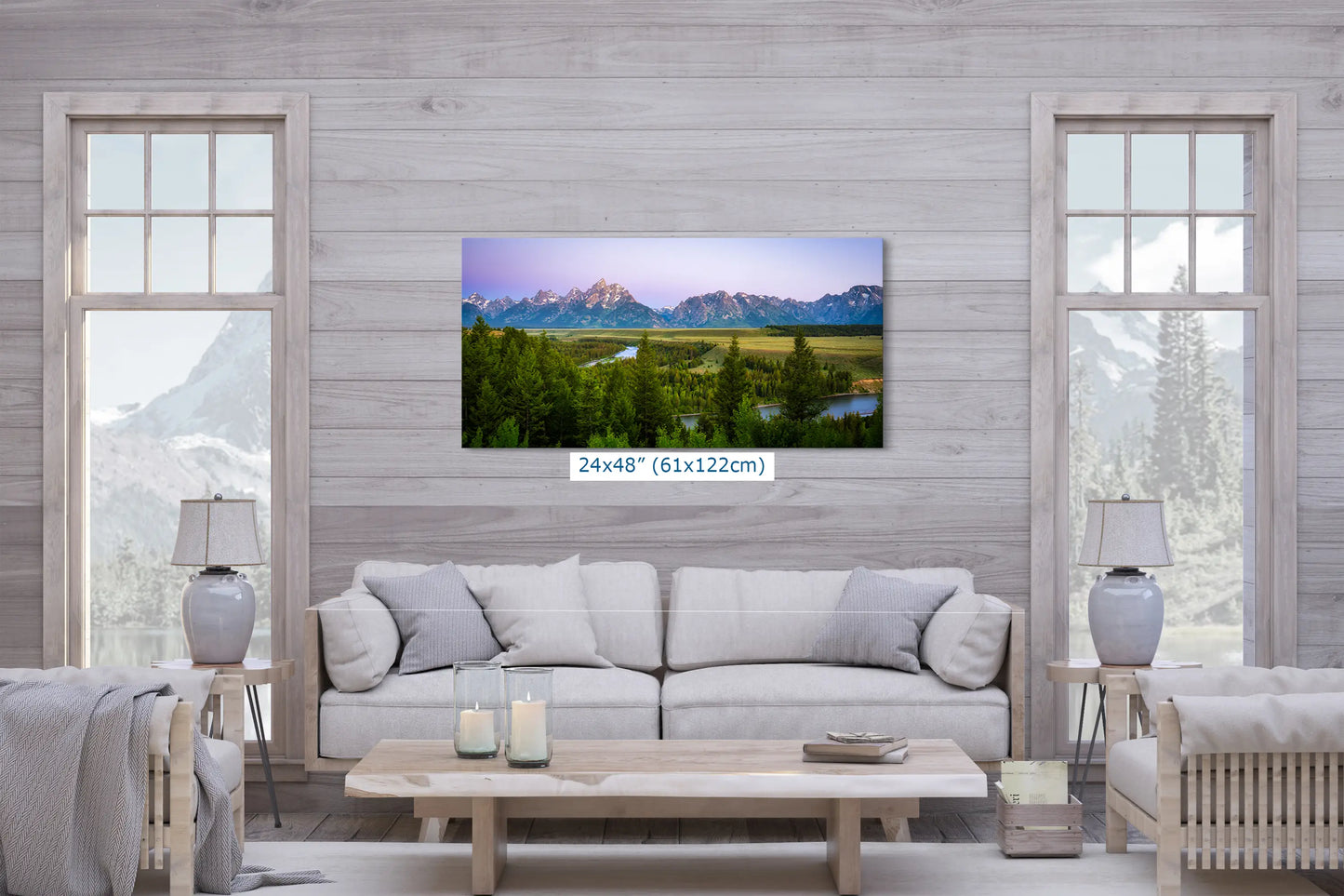 a living room filled with furniture and a painting on the wall