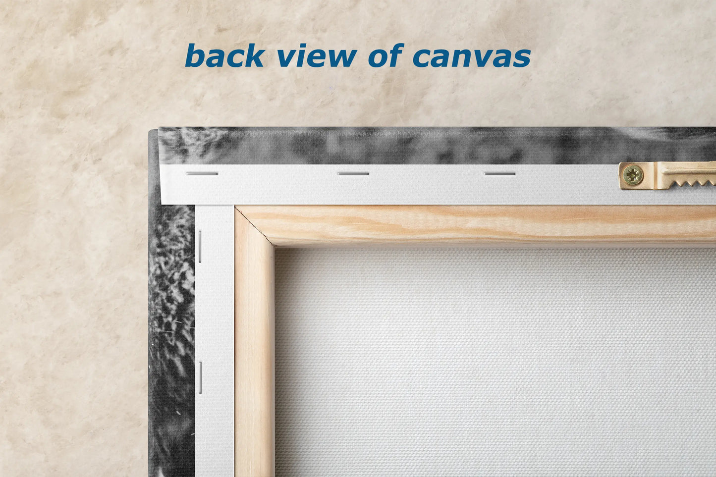 the back view of a canvas with a wooden frame