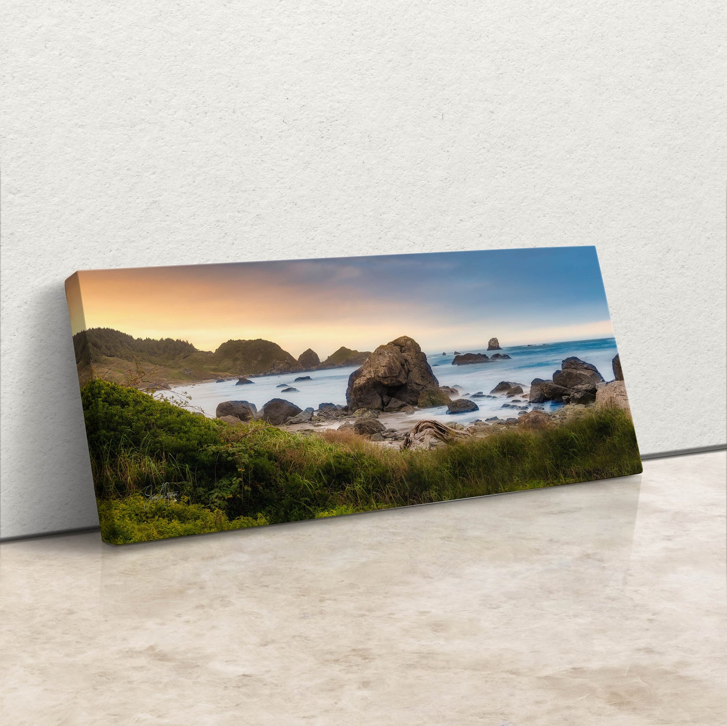 a picture of a beach with rocks in the water
