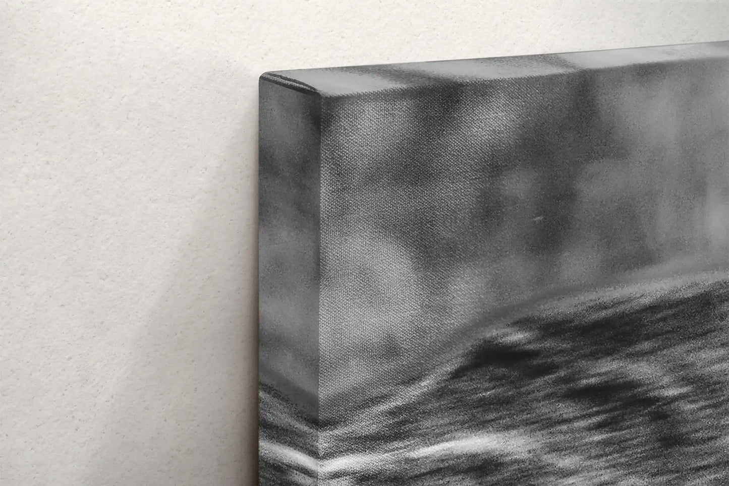 Close-up of the texture and edge of a black and white canvas print showing a detailed duel between two bison.