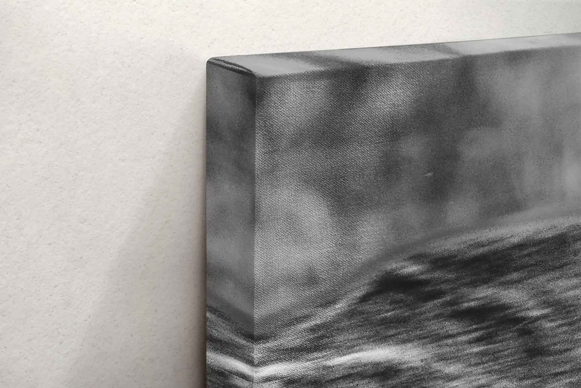 Close-up of the texture and edge of a black and white canvas print showing a detailed duel between two bison.