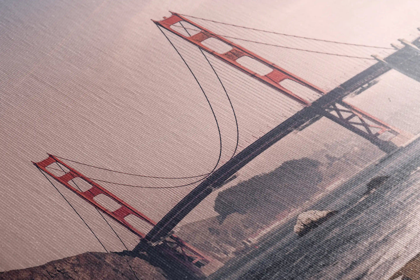 Textured detail of a canvas print highlighting the Golden Gate Bridge, offering a tactile dimension to this vintage San Francisco wall art.