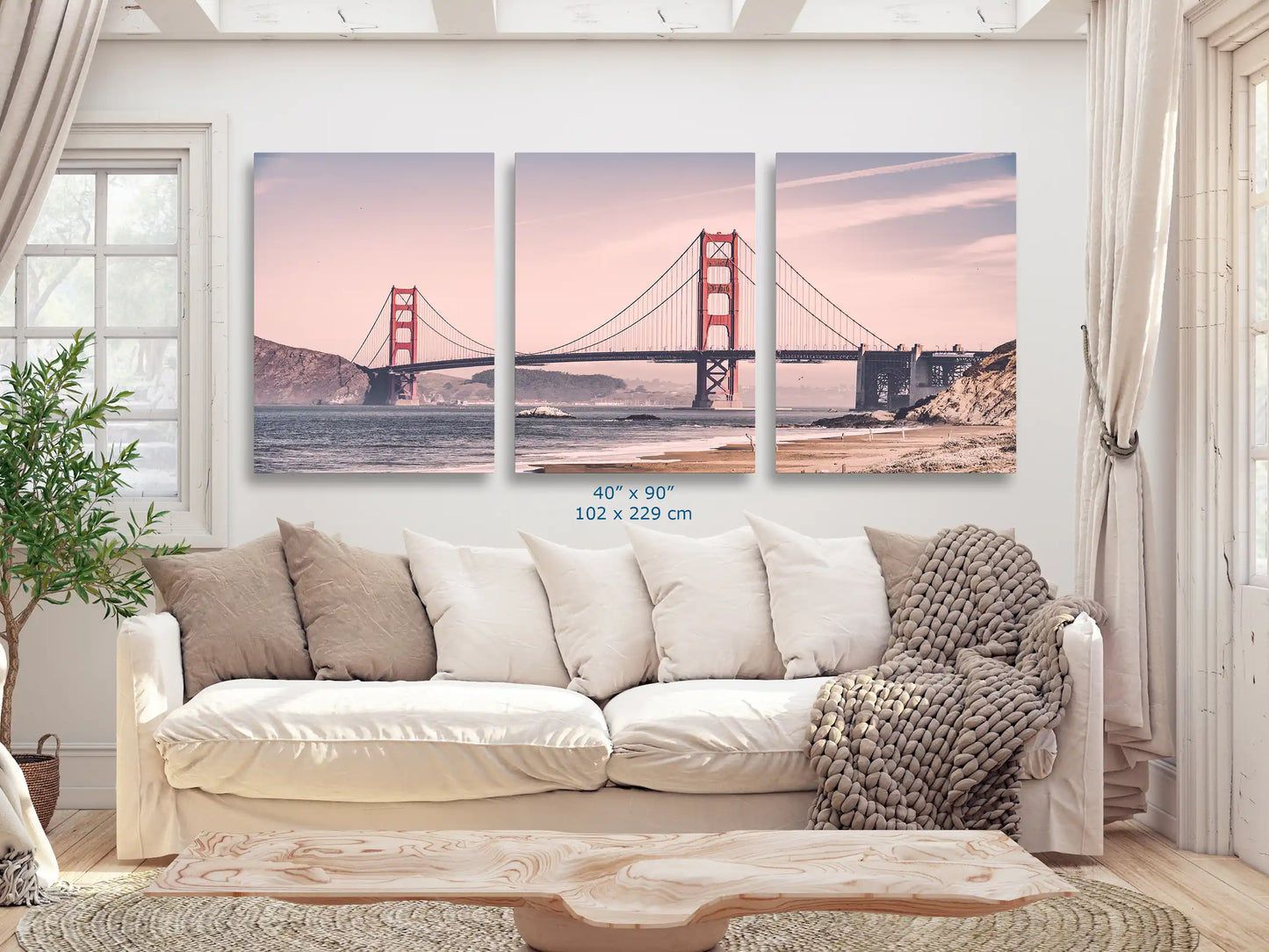 An expansive 40x90 canvas print of the Golden Gate Bridge in vintage tones, making a grand statement in a cozy living room.