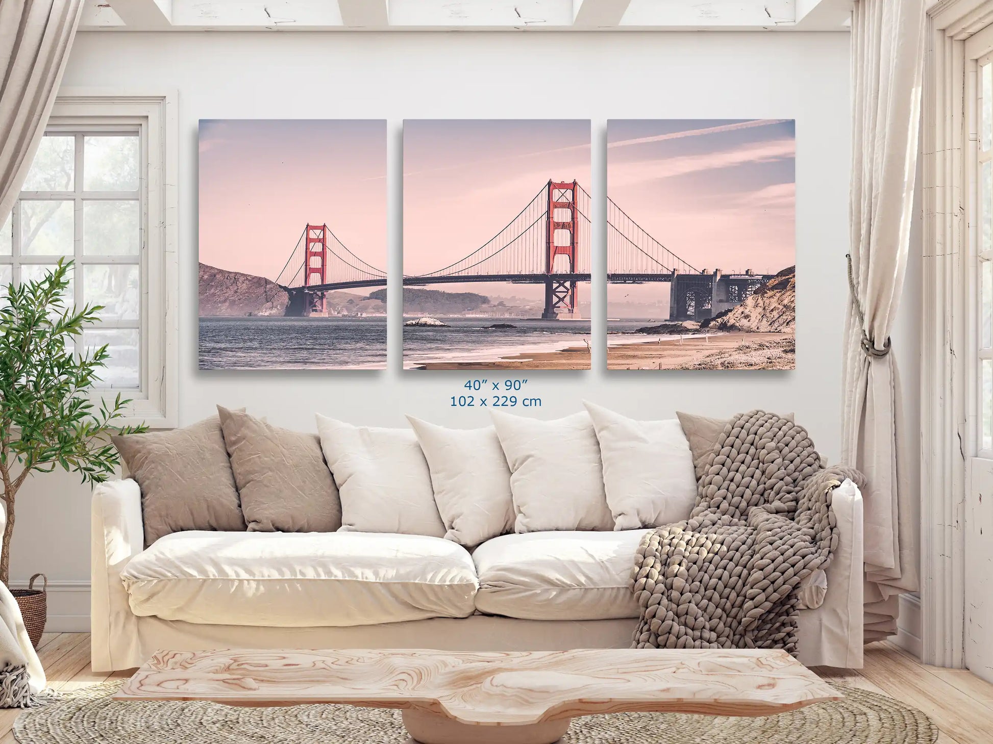 An expansive 40x90 canvas print of the Golden Gate Bridge in vintage tones, making a grand statement in a cozy living room.