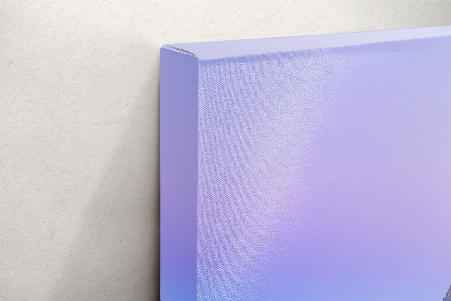 Side view of a canvas print highlighting the purple sky over the Teton Mountains at sunrise.