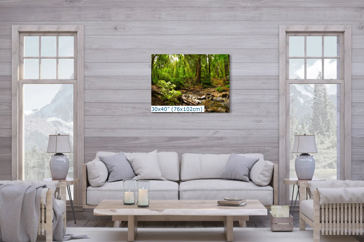 A canvas print measuring 30x40 inches in a living room, depicting a forest with redwood trees and a sunlit creek.