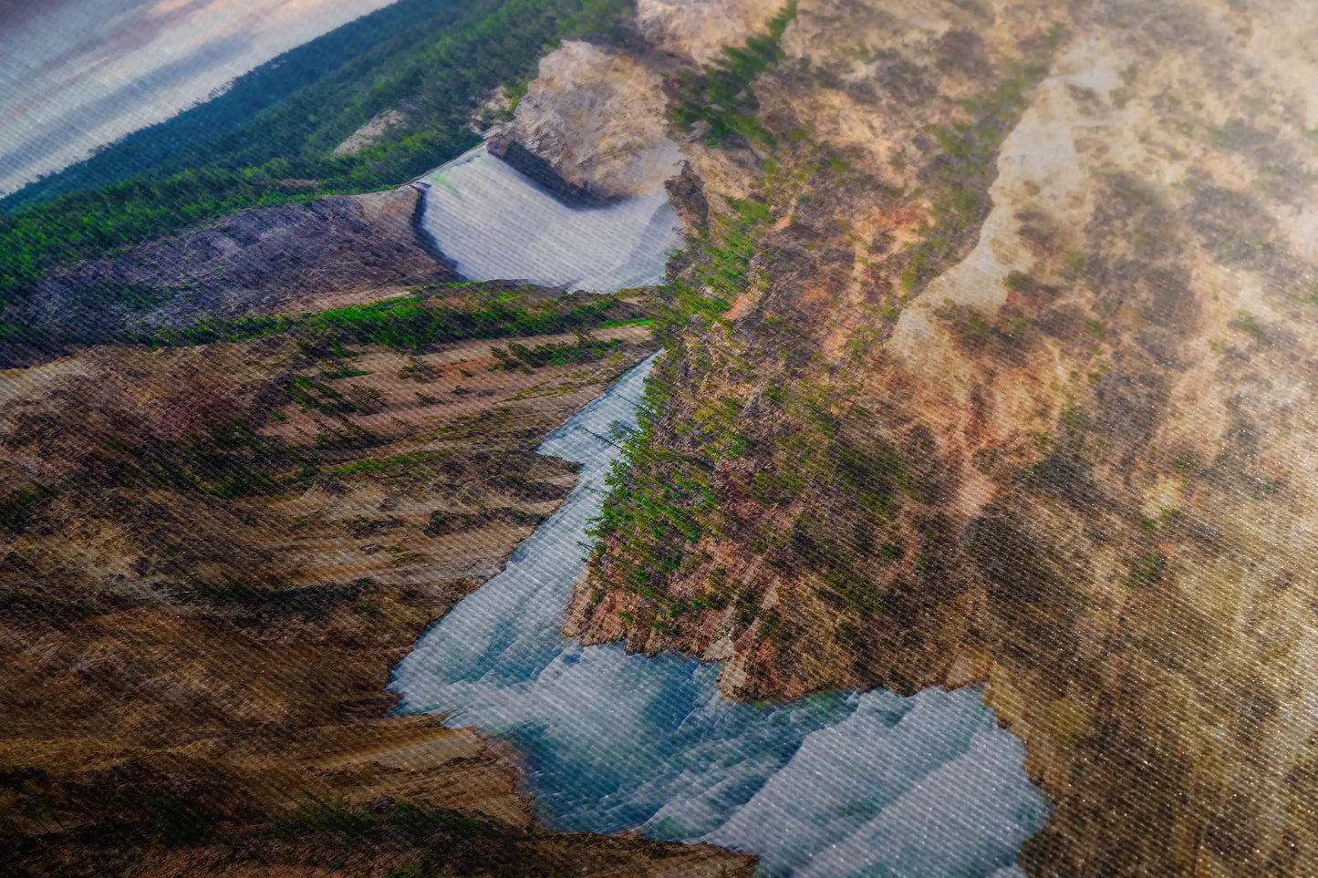 Close-up of a canvas wall art piece, highlighting the intricate textures of Lower Yellowstone Falls and the surrounding canyon, emphasizing the vibrant water hues.