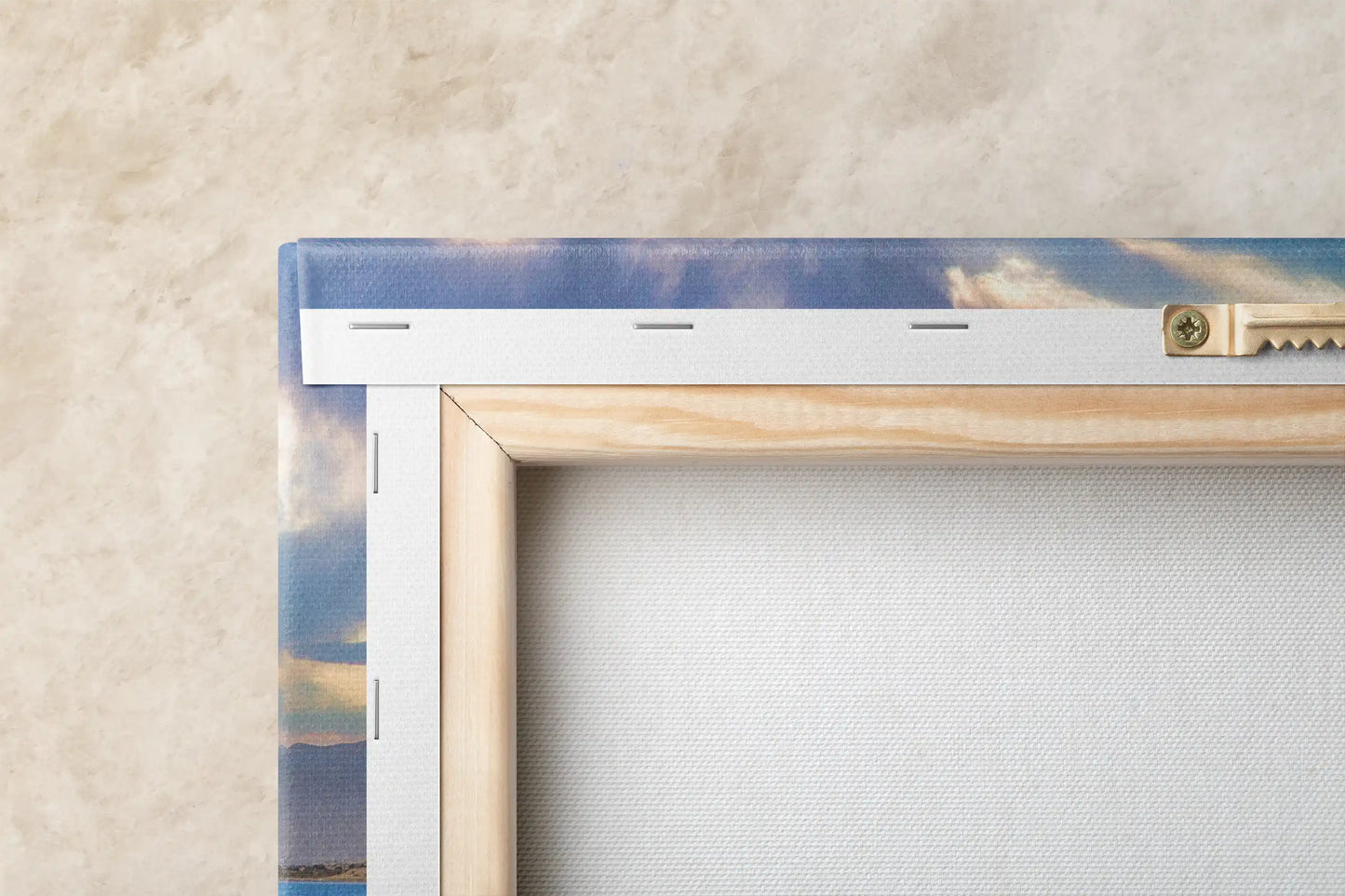 Back of a canvas print showing the wooden stretcher frame with a wire for hanging, edges of the print visible.