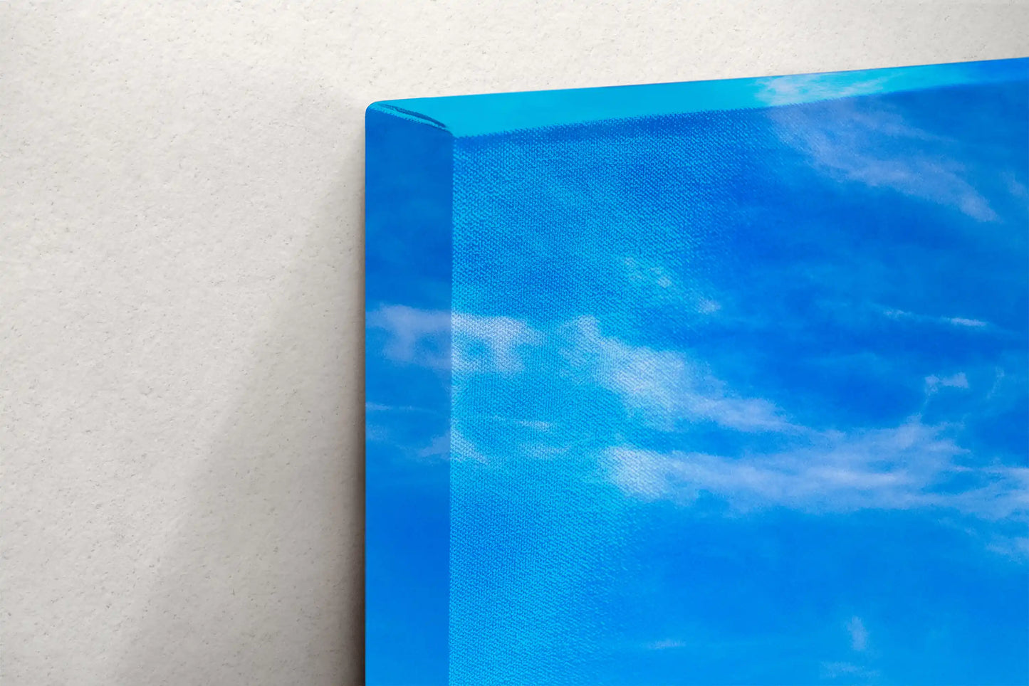 Canvas texture close-up with Morro Rock in the distance, emphasizing the fine art quality and coastal allure of the photograph.