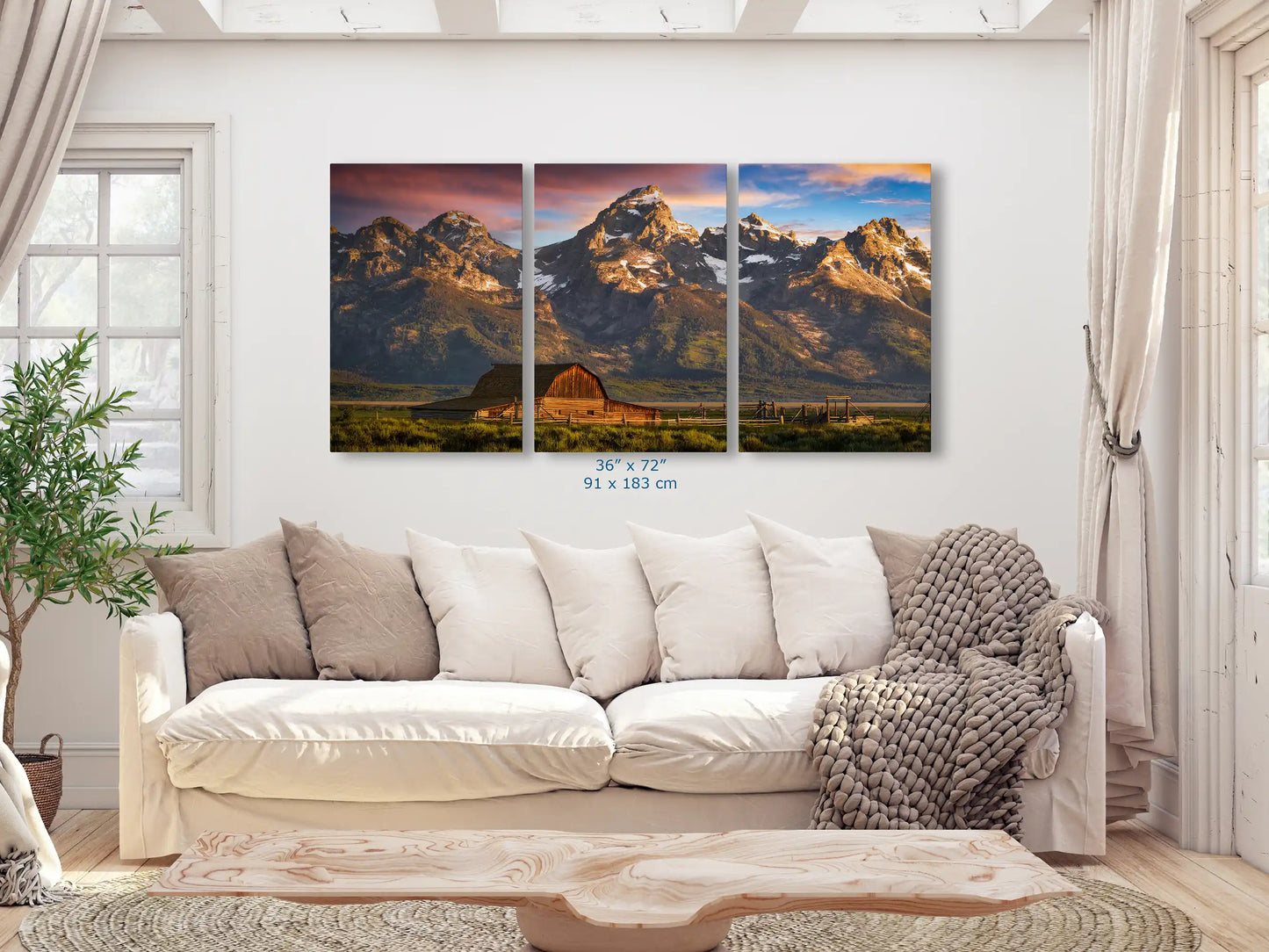 A three-piece canvas in 36x72-inches set over a couch, each showing a section of the John Moulton Homestead and Teton Mountains at sunrise, together creating a panoramic effect.