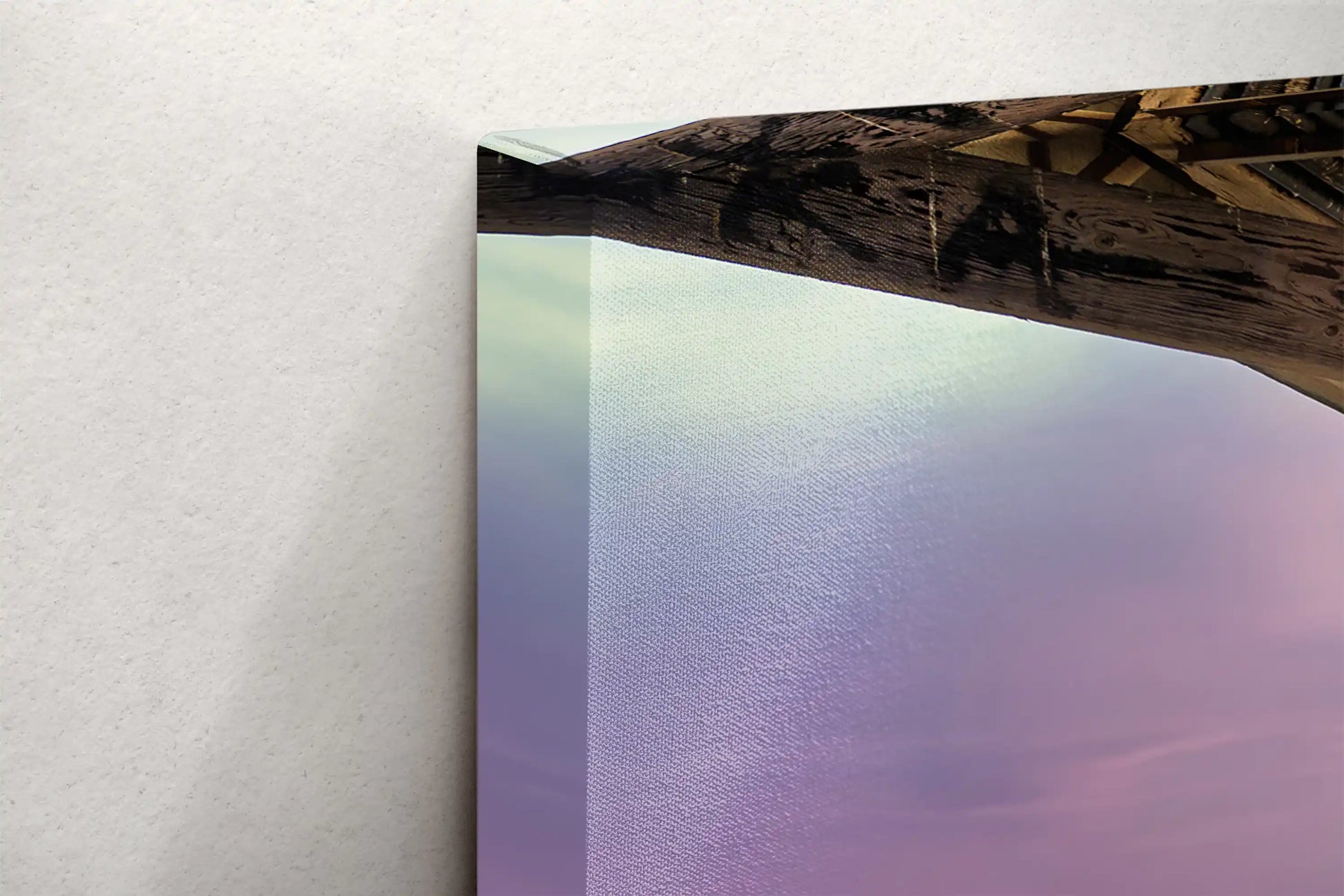 Side view of canvas wall art depicting the Balboa Pier at sunset, showcasing the sturdy frame and vibrant colors of the seascape.