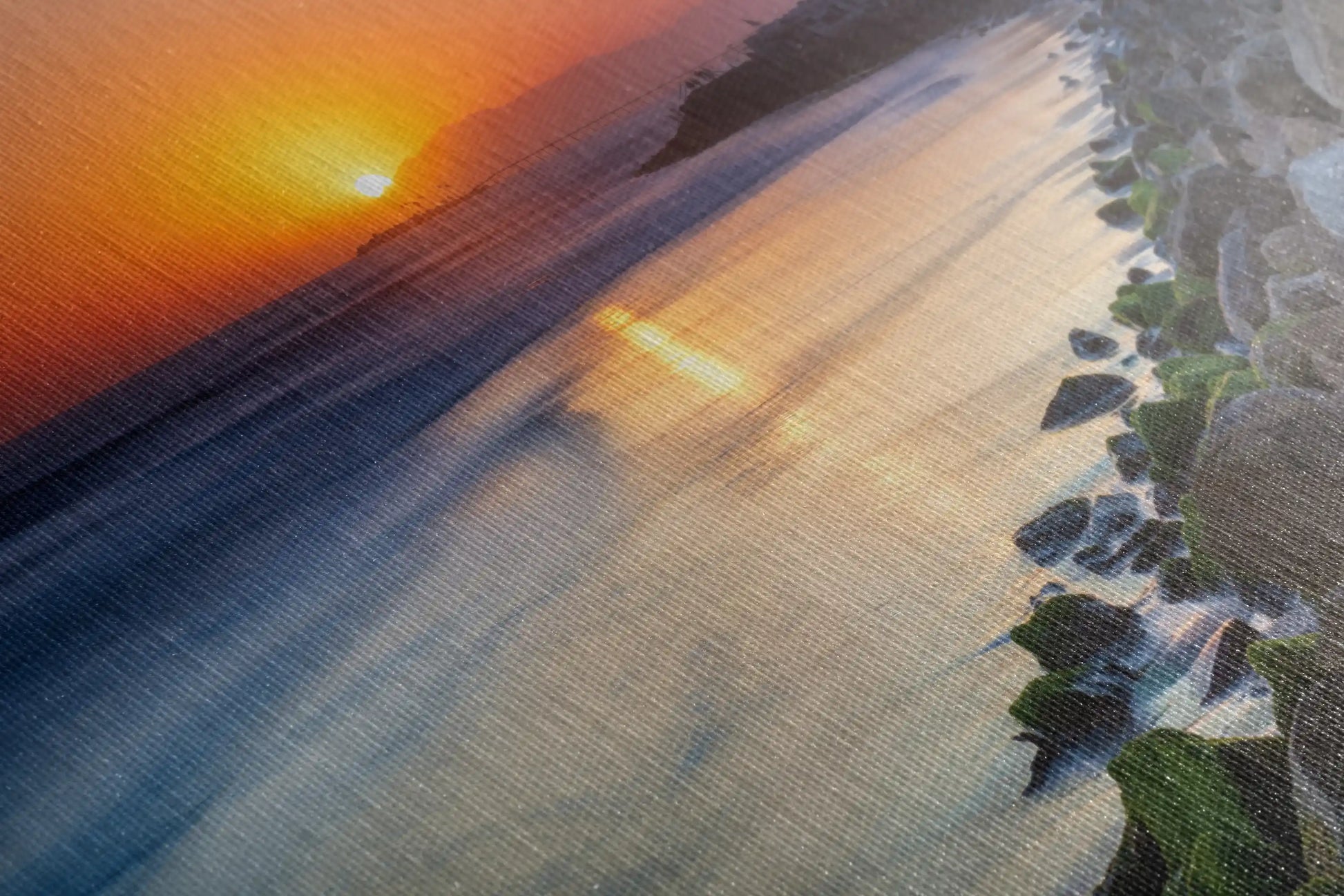 A detailed view of the canvas texture of Ventura Beach Sunset wall art, emphasizing the vibrant colors and the soft blending of the sunset.