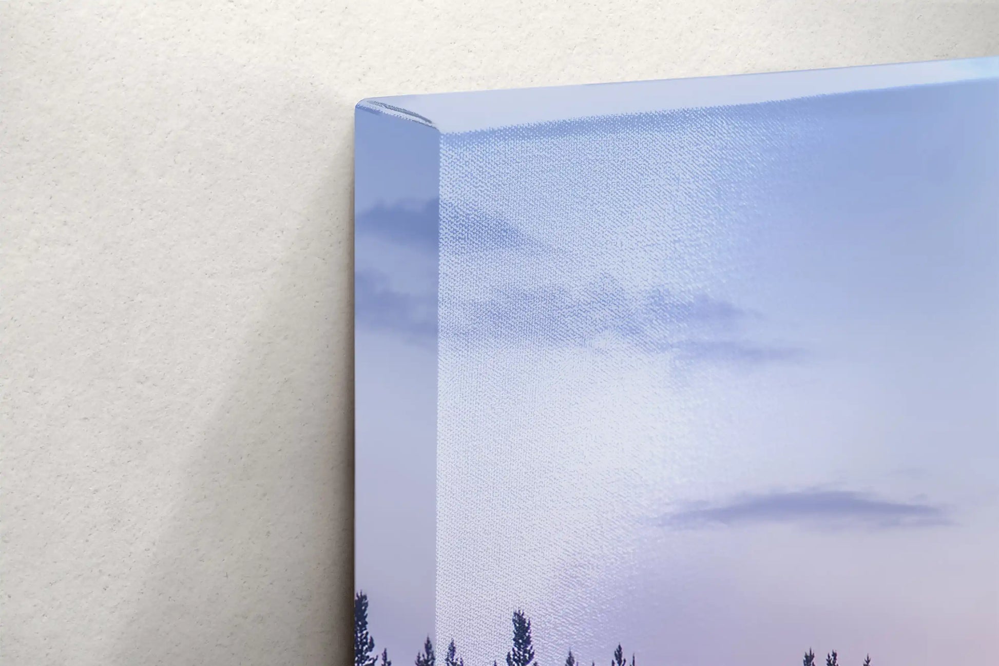 Detailed close-up of a canvas depicting Yellowstone Lake's sunrise, focusing on the print's quality and the misty forest reflection.