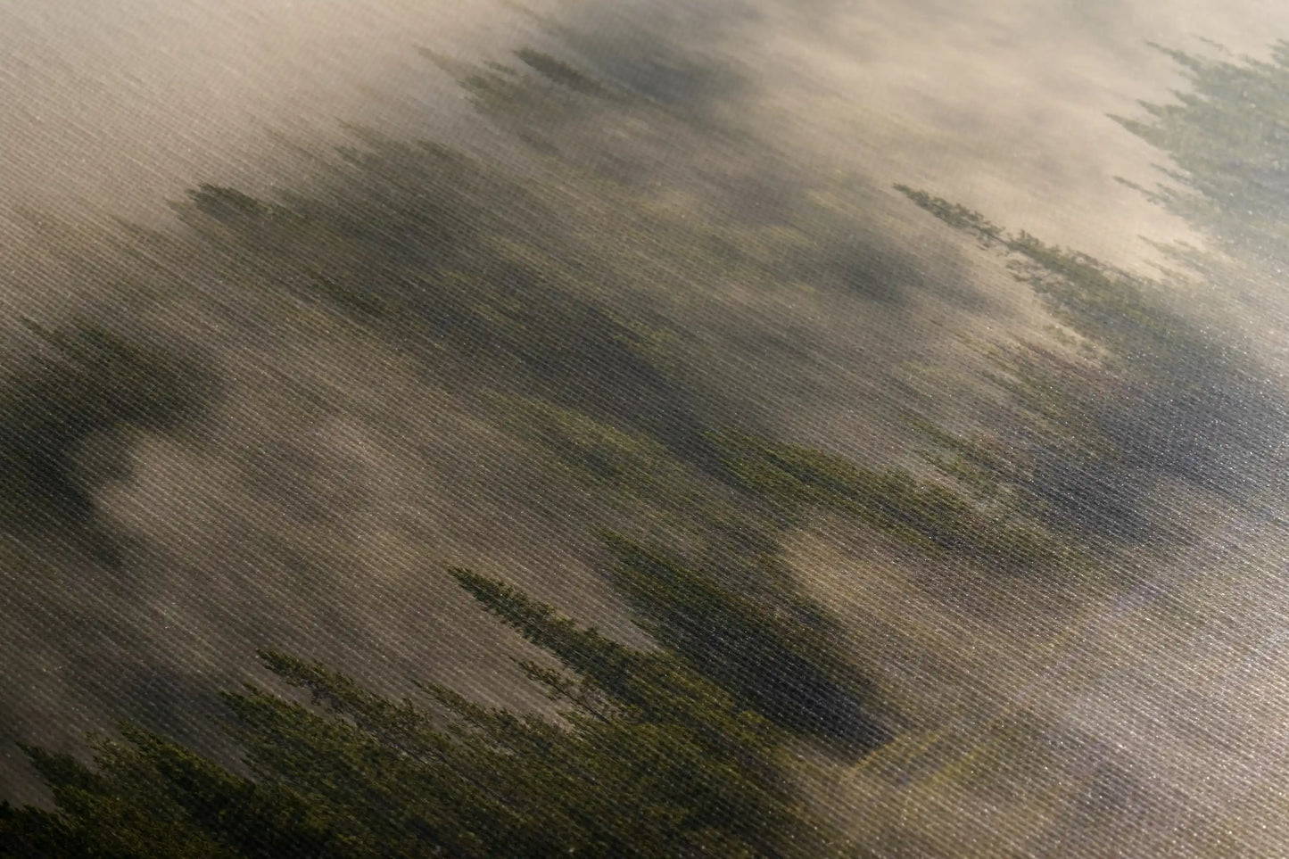 Close-up of a canvas showing a detailed foggy forest scene from Yellowstone, with textured brush strokes and a blend of greens and greys.