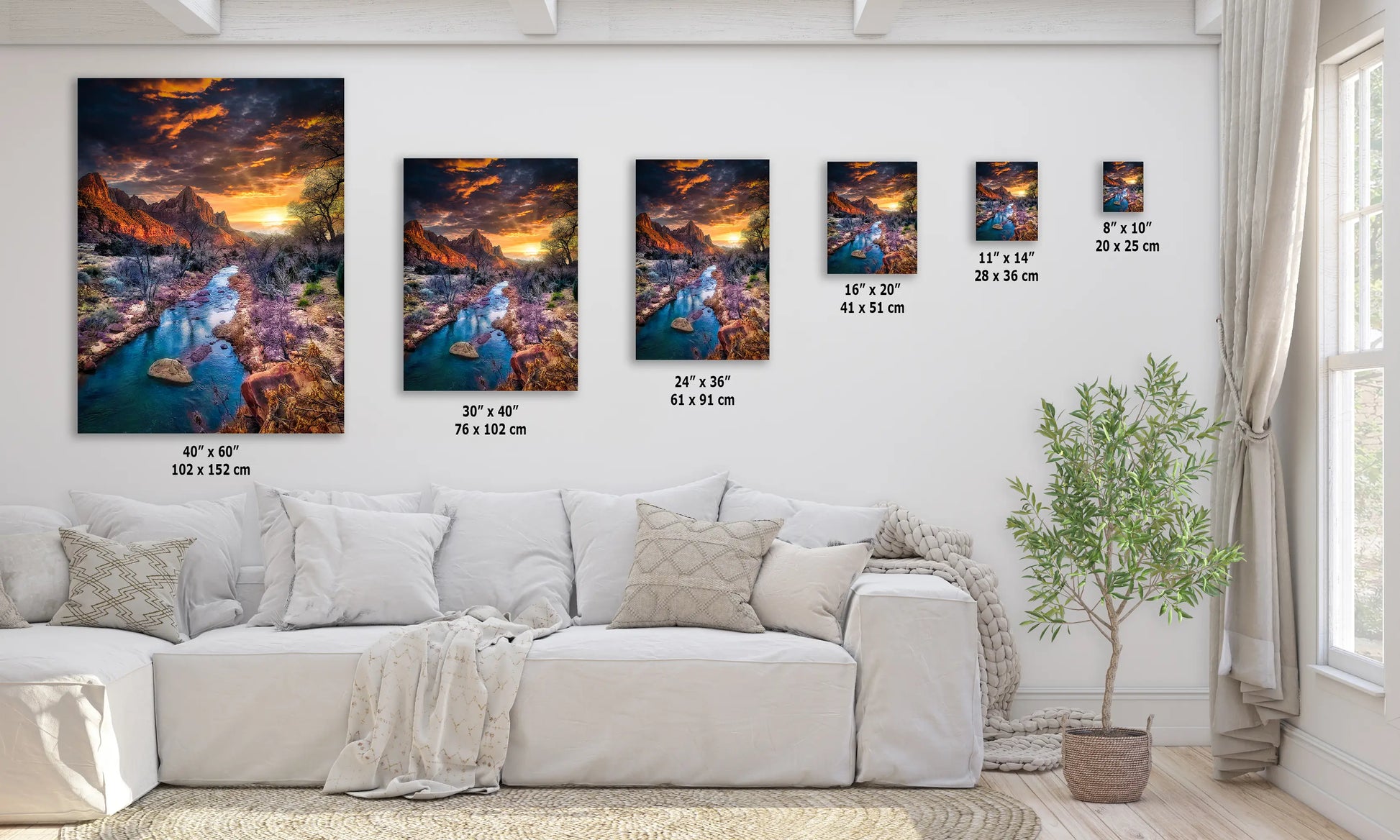 a living room with a white couch and paintings on the wall