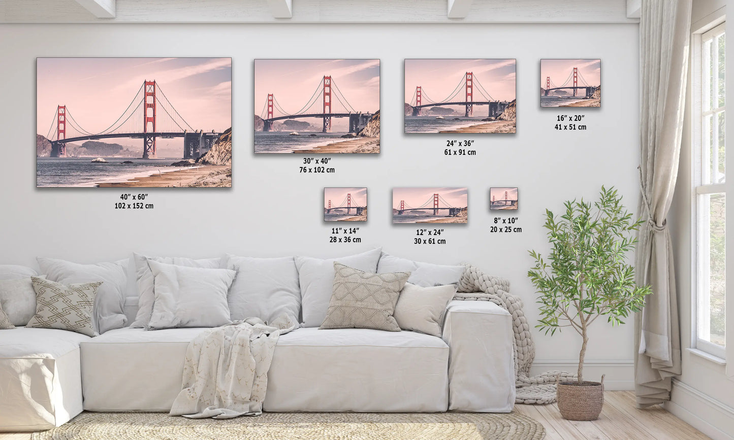 a living room with a white couch and paintings on the wall