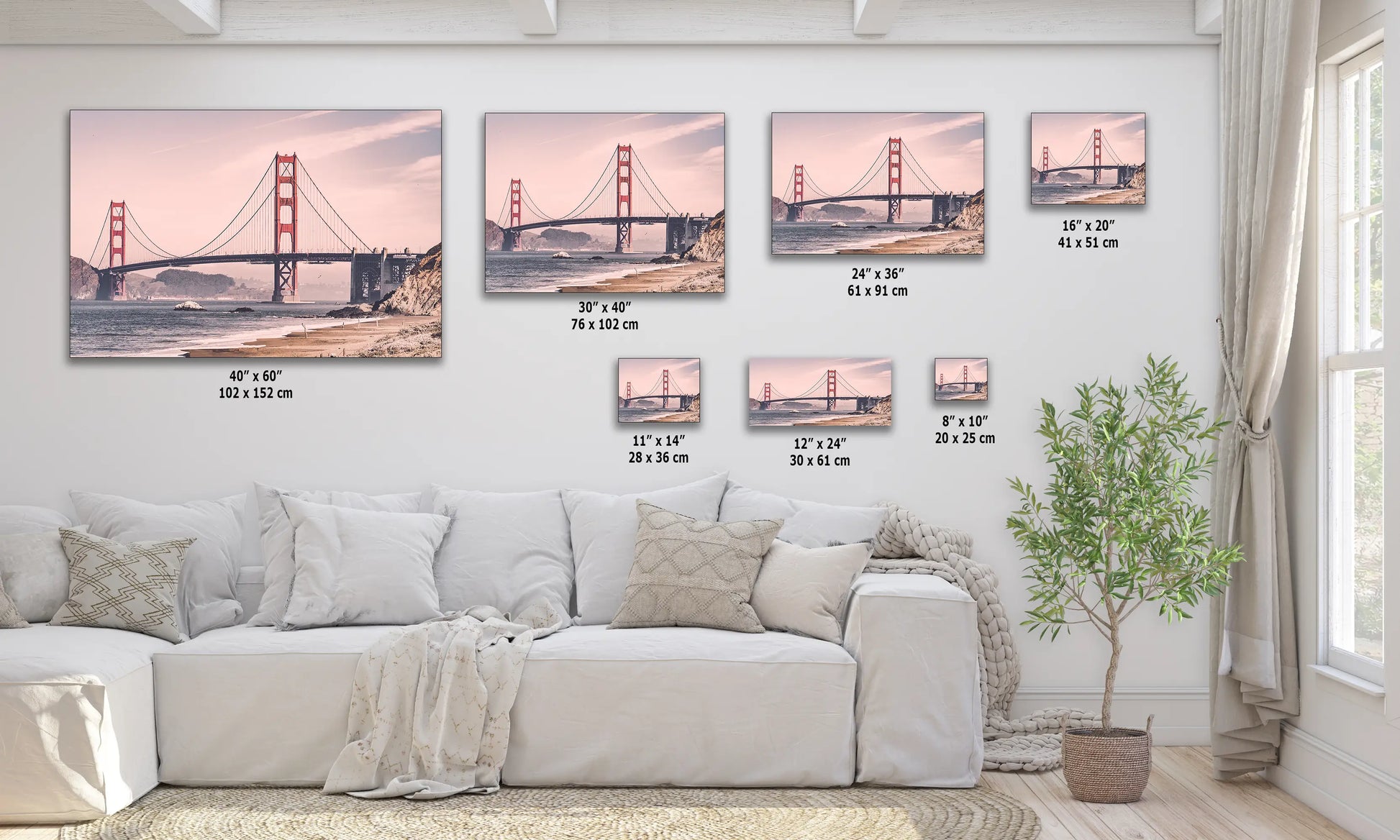 a living room with a white couch and paintings on the wall