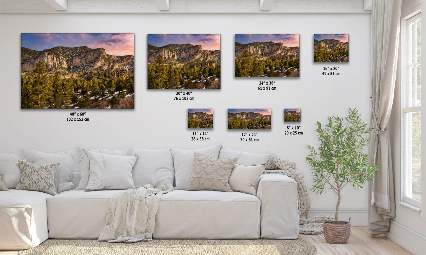 a living room filled with furniture and pictures on the wall