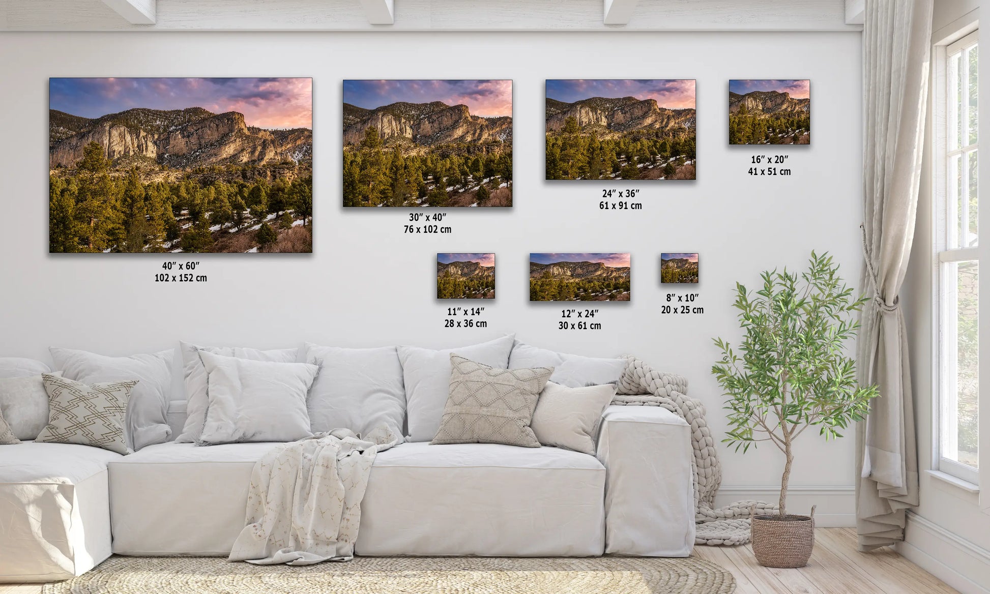 a living room filled with furniture and pictures on the wall
