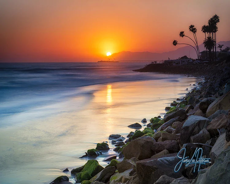 Golden Ventura sunset with the sun dipping into the ocean, creating a warm, inviting atmosphere