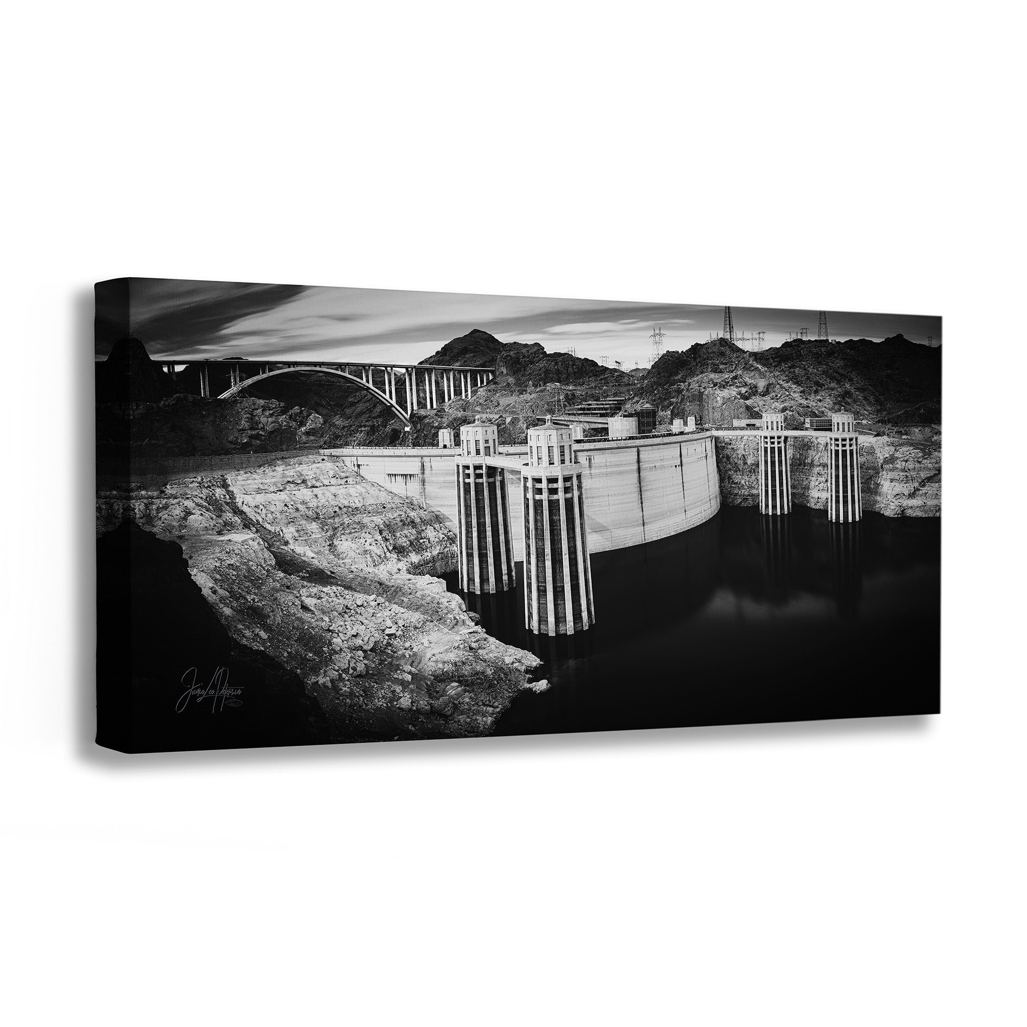Black and white canvas print of a dam and surrounding landscape.