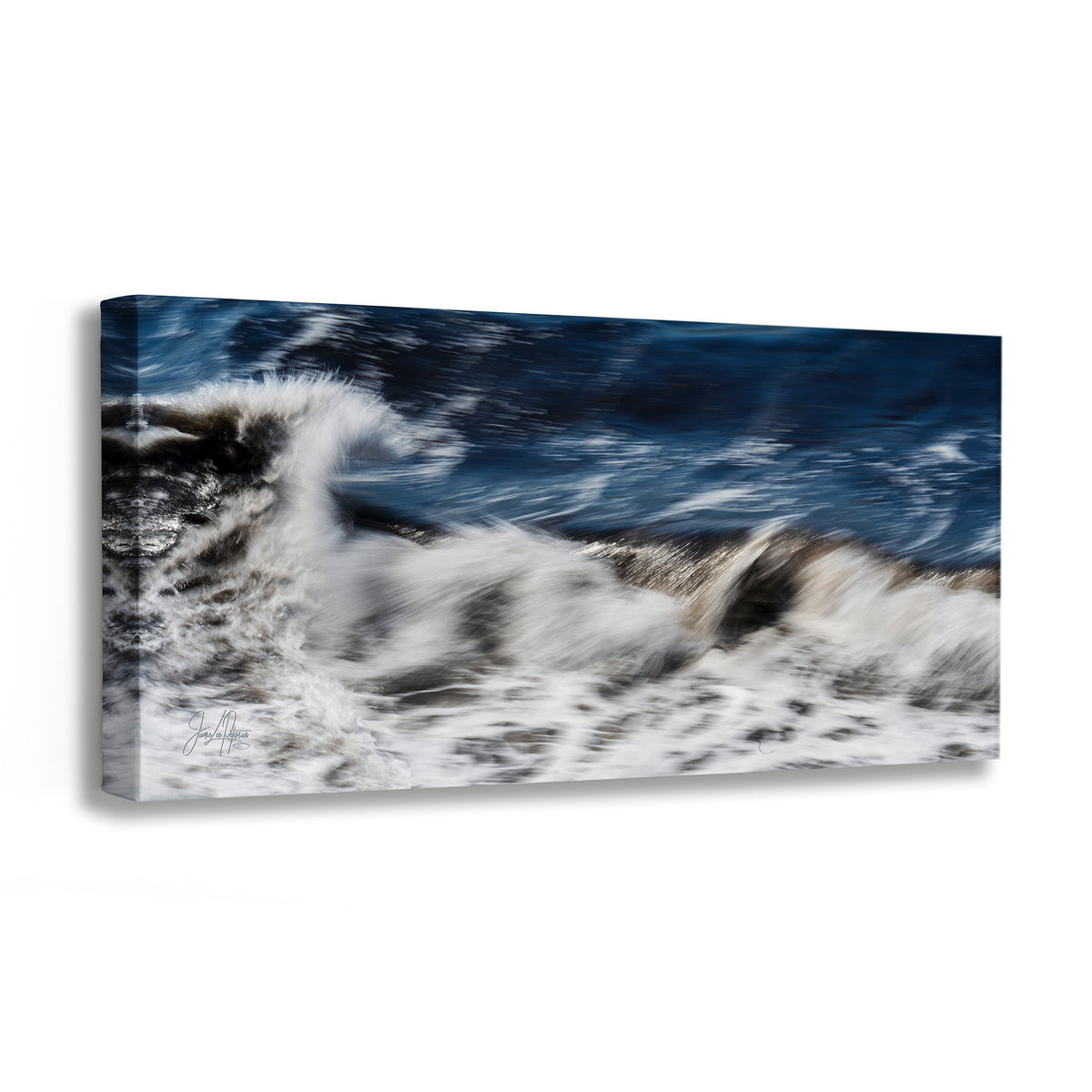A rectangular canvas wall art print showing an abstract seascape with dark blue water and white surf, photographed against a clean white background.