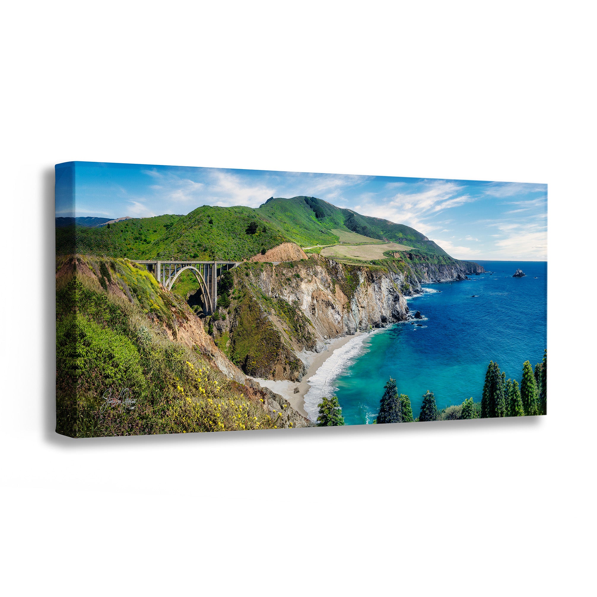 Canvas print of a scenic coastal landscape with a bridge and blue ocean.
