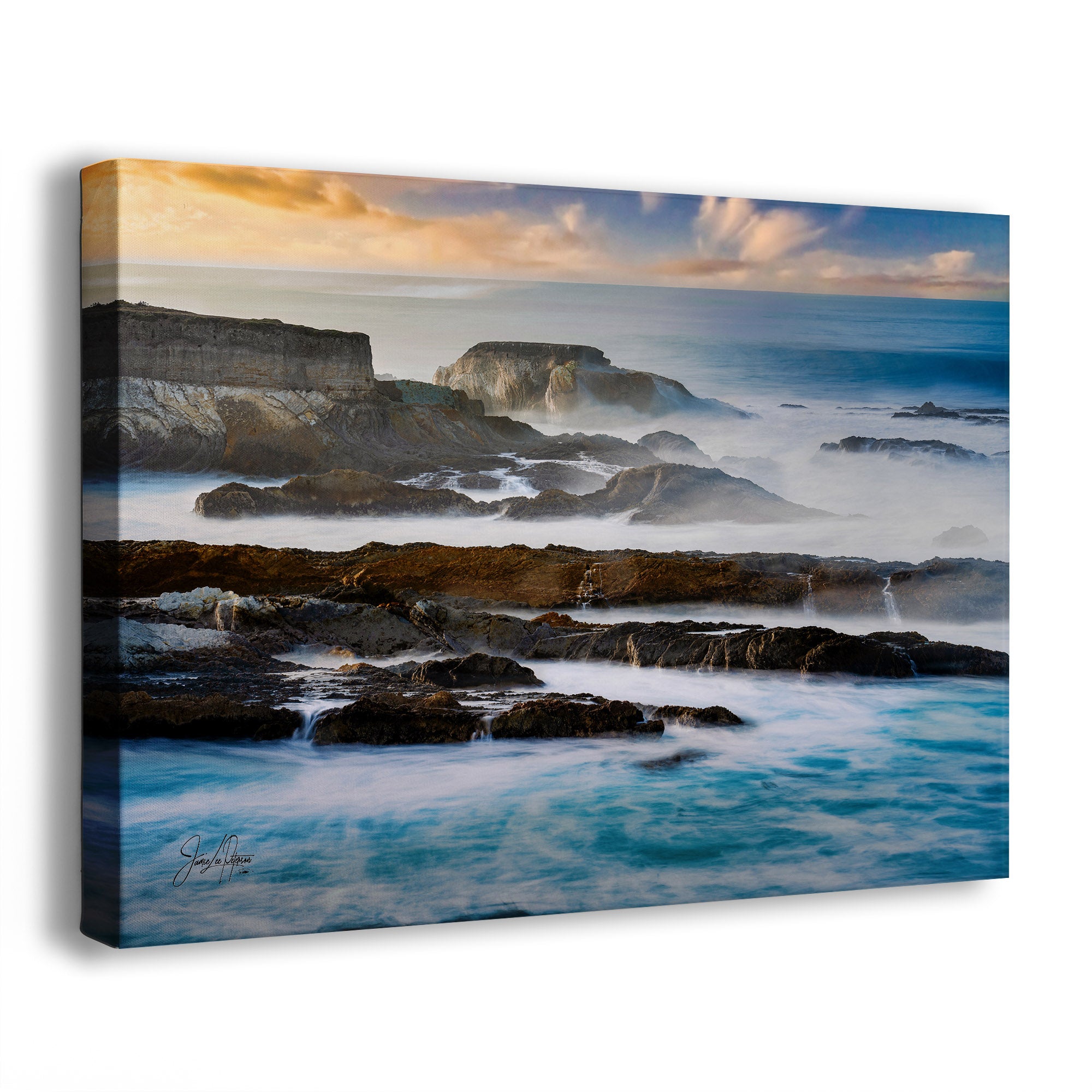 Canvas print of a coastal scene with rocks and ocean waves.