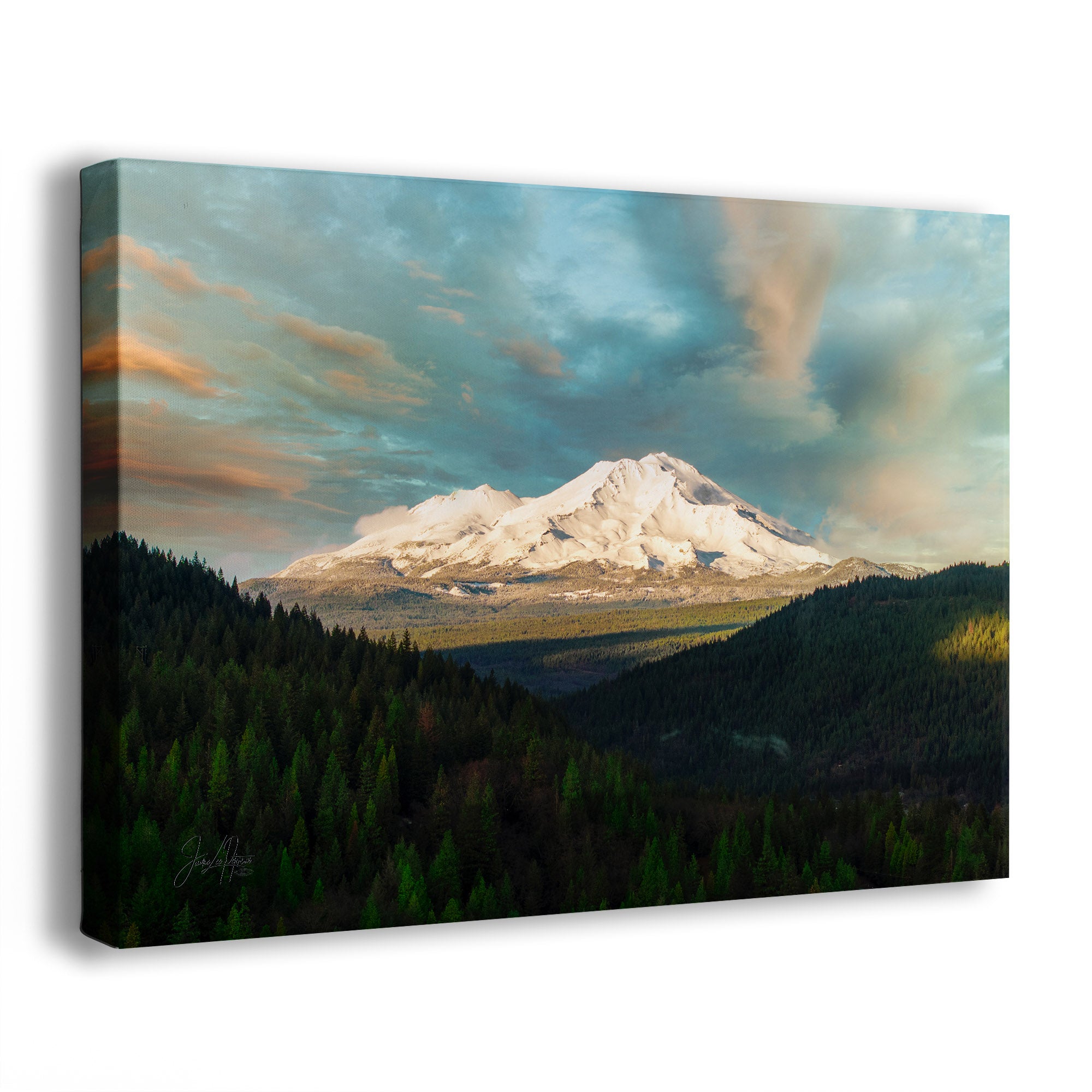 Side view of a canvas print of the Mt. Shasta, California mountain landscape with trees and a cloudy sky.