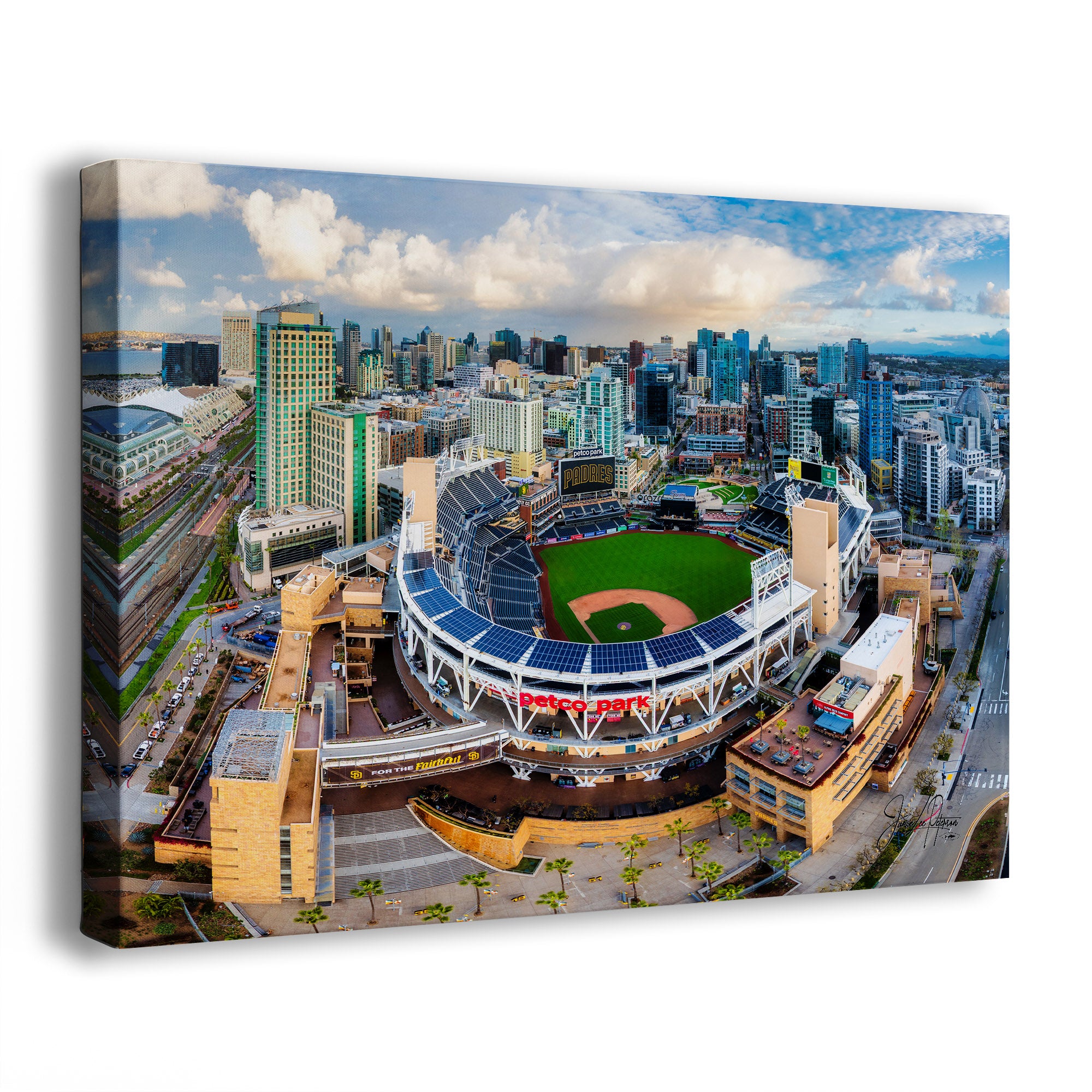 A San Diego Padres skyline art print showing an aerial view of Petco Park baseball stadium surrounded by San Diego high-rises, photographed at an angle against a plain white background.