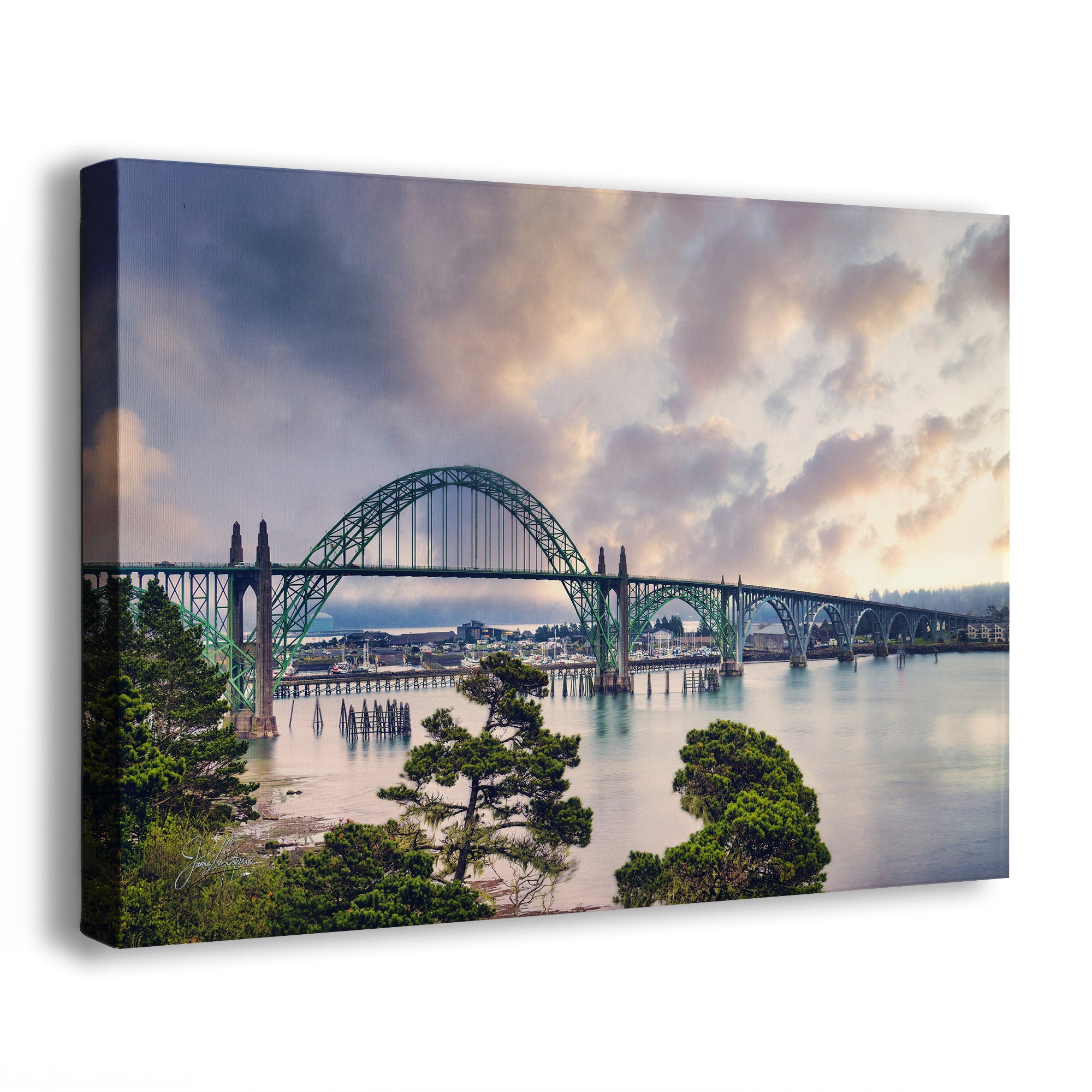 A canvas wall art print of the Alsea Bay Bridge with a pink cloudy sky.