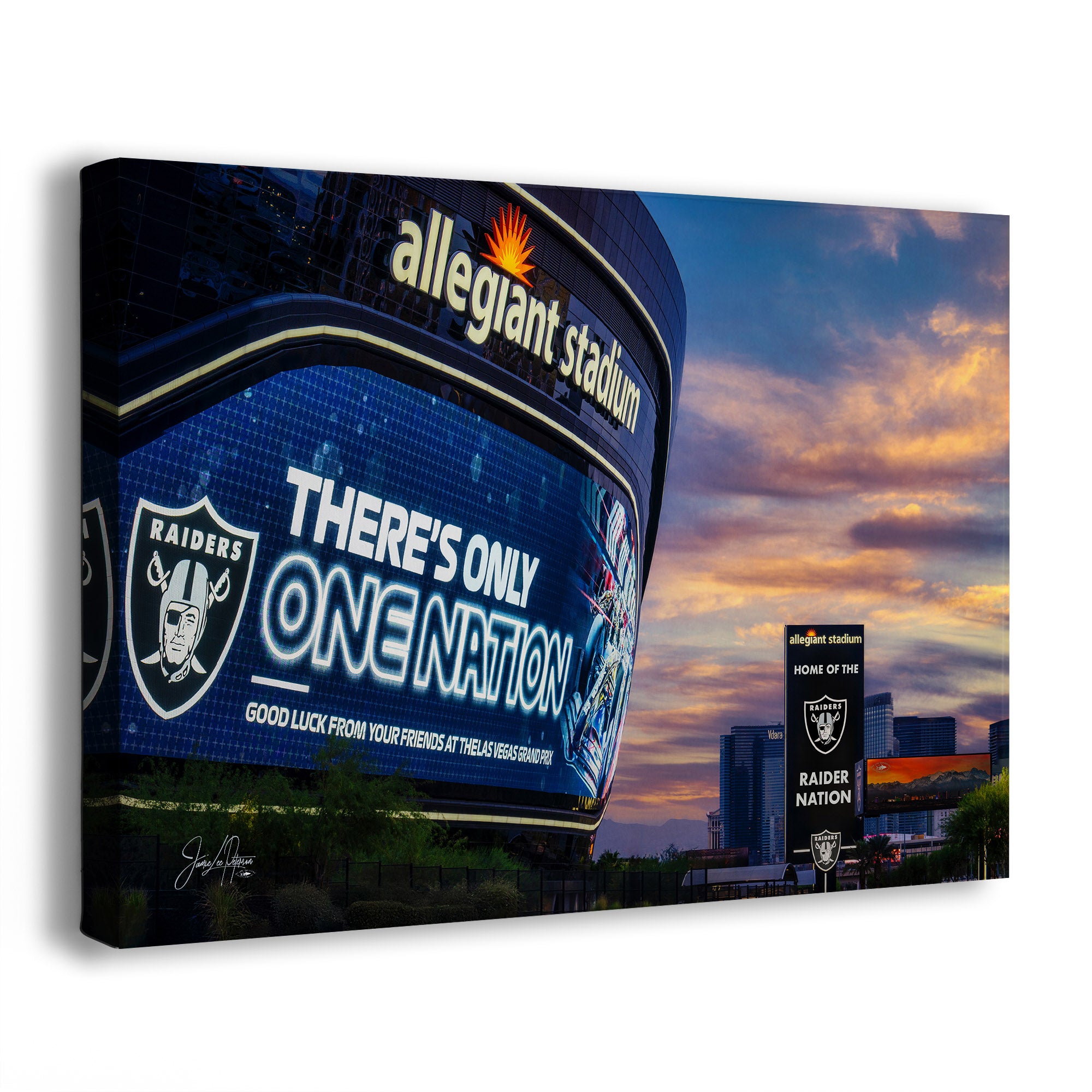 A wall art print showing an evening Las Vegas city skyline at Allegiant Stadium, with a large Raiders digital scoreboard and the text 'There's Only One Nation.' The print is photographed at an angle against a plain white background.