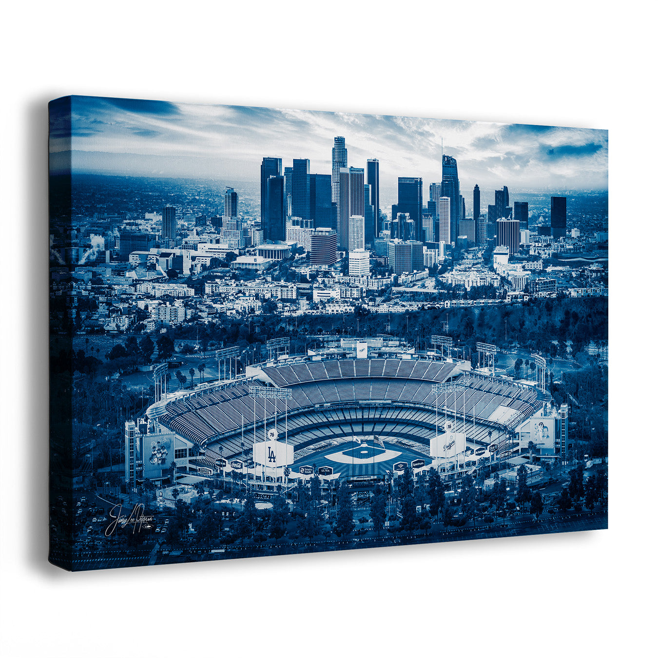 A Dodger Stadium skyline wall art print showing an aerial view of a stadium in the foreground and a city skyline in the background, rendered in monochrome blue tones. The canvas is photographed at a slight angle against a plain white background.