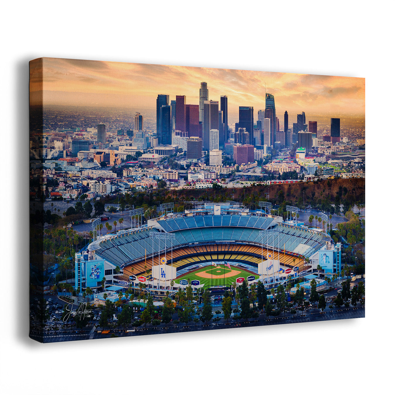 A rectangular Dodger Stadium wall art print showing an aerial view of the Los Angeles skyline and stadium at sunrise, photographed against a plain white background.