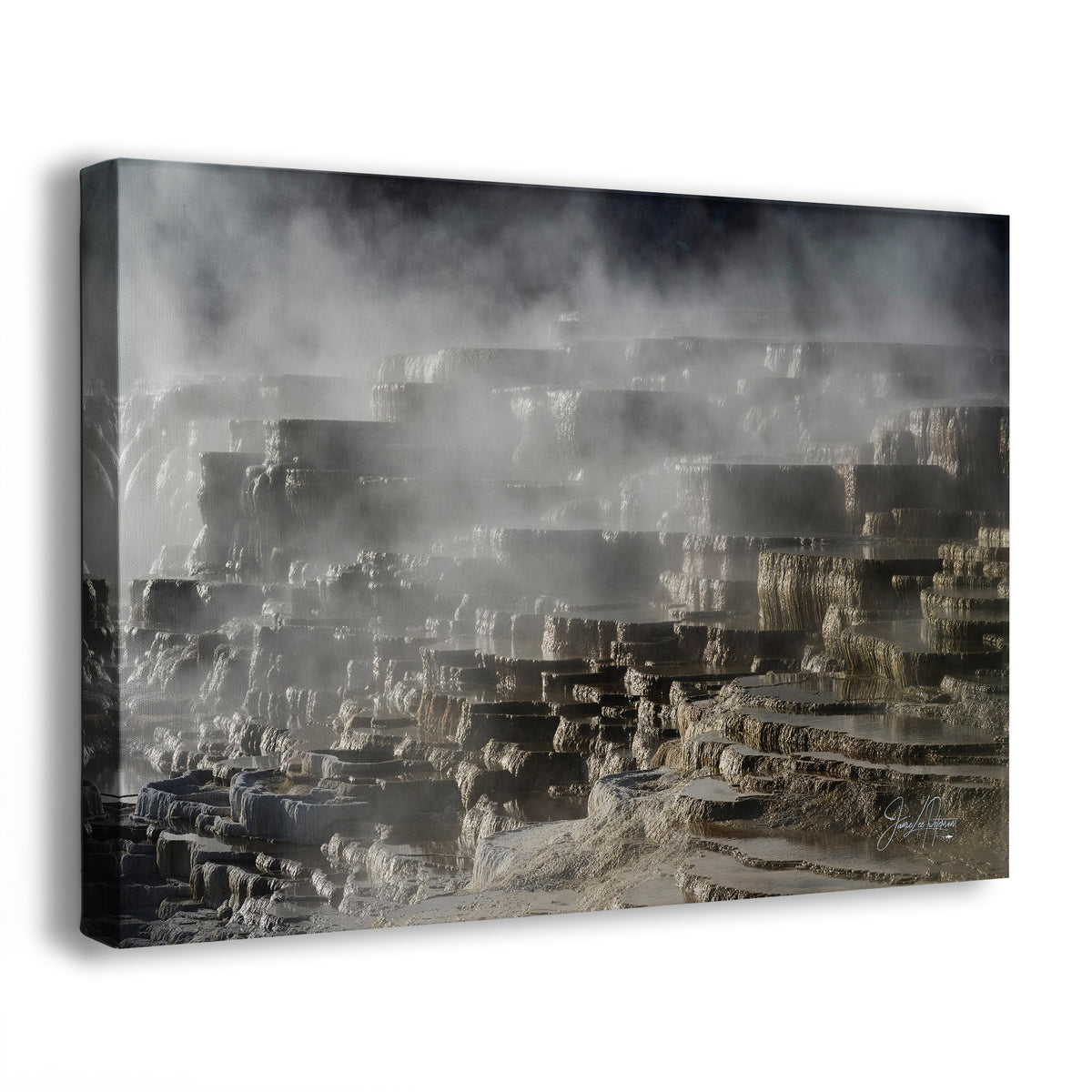 A canvas wall art print showing a misty geothermal Travertine terrace in Mammoth Hot Springs of Yellowstone National Park, Wyoming, in gray, beige, and brown tones, photographed against a plain white background.