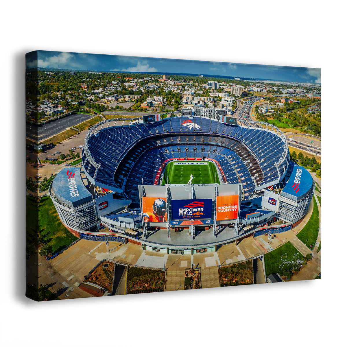 A Denver Broncos Stadium art print showing an aerial view of the Denver Broncos Mile High football stadium, photographed at an angle against a plain white background.