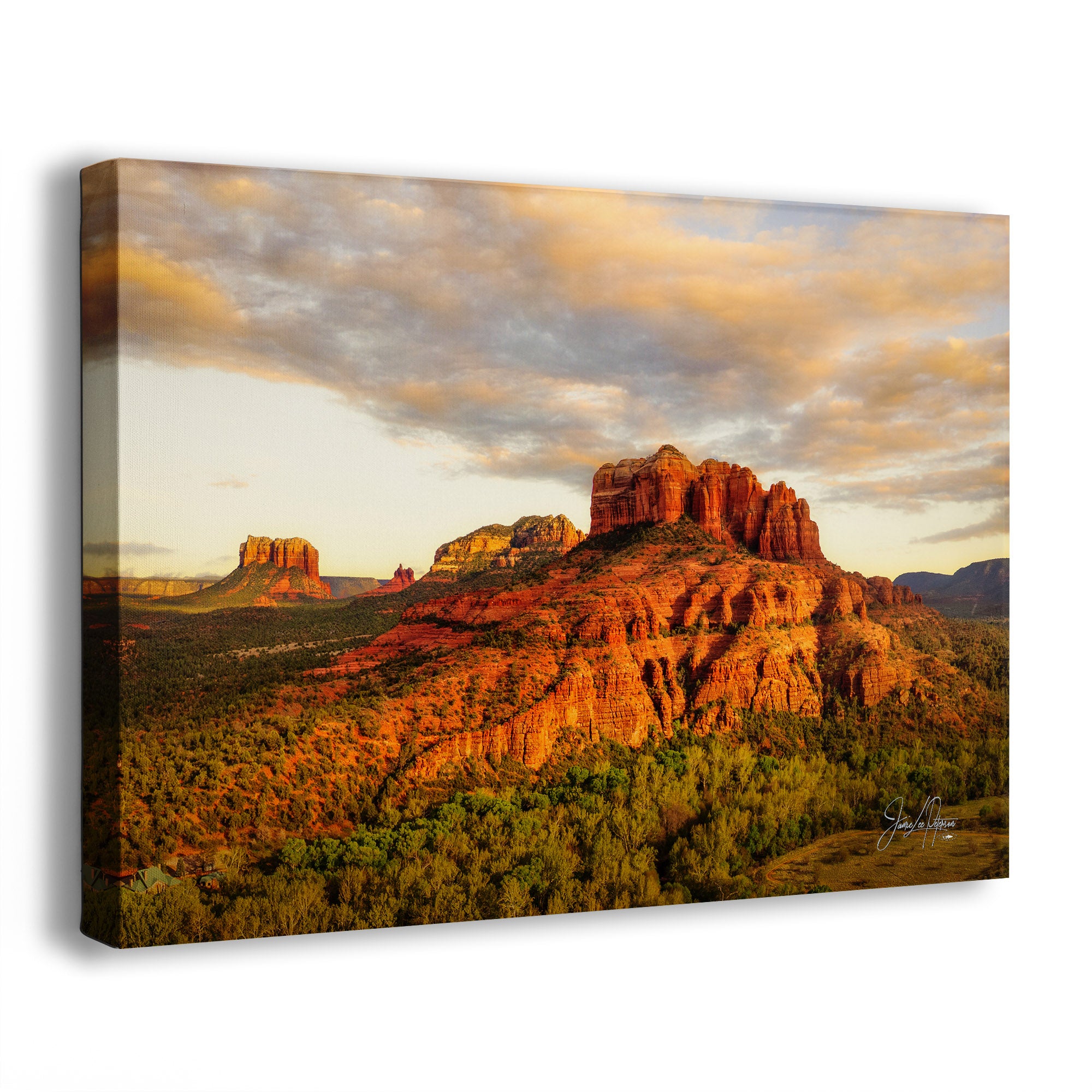 A side view of a canvas print of Cathedral Rock in Sedona, Arizona, a desert landscape with red rock formations and a sunset sky.