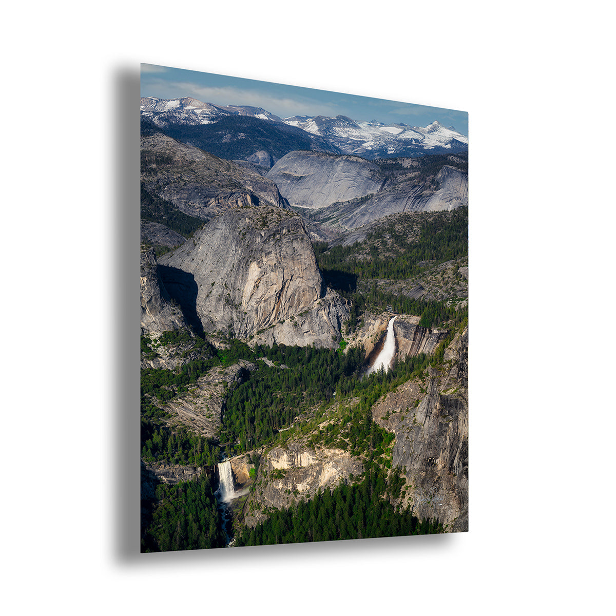 A vertical wall art print depicting a dramatic mountain landscape with Nevada and Vernal Falls, shown at a slight angle against a white background.