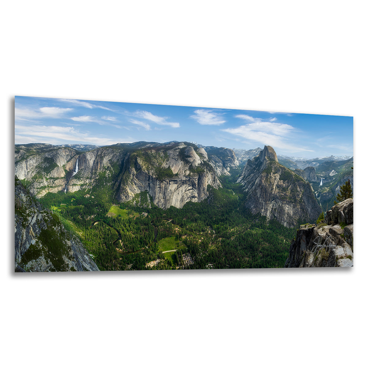 Panoramic landscape wall art showing Yosemite Valley from Glacier Point with Half Dome, green forests, and blue sky with white clouds, presented as a rectangular print on a white background.