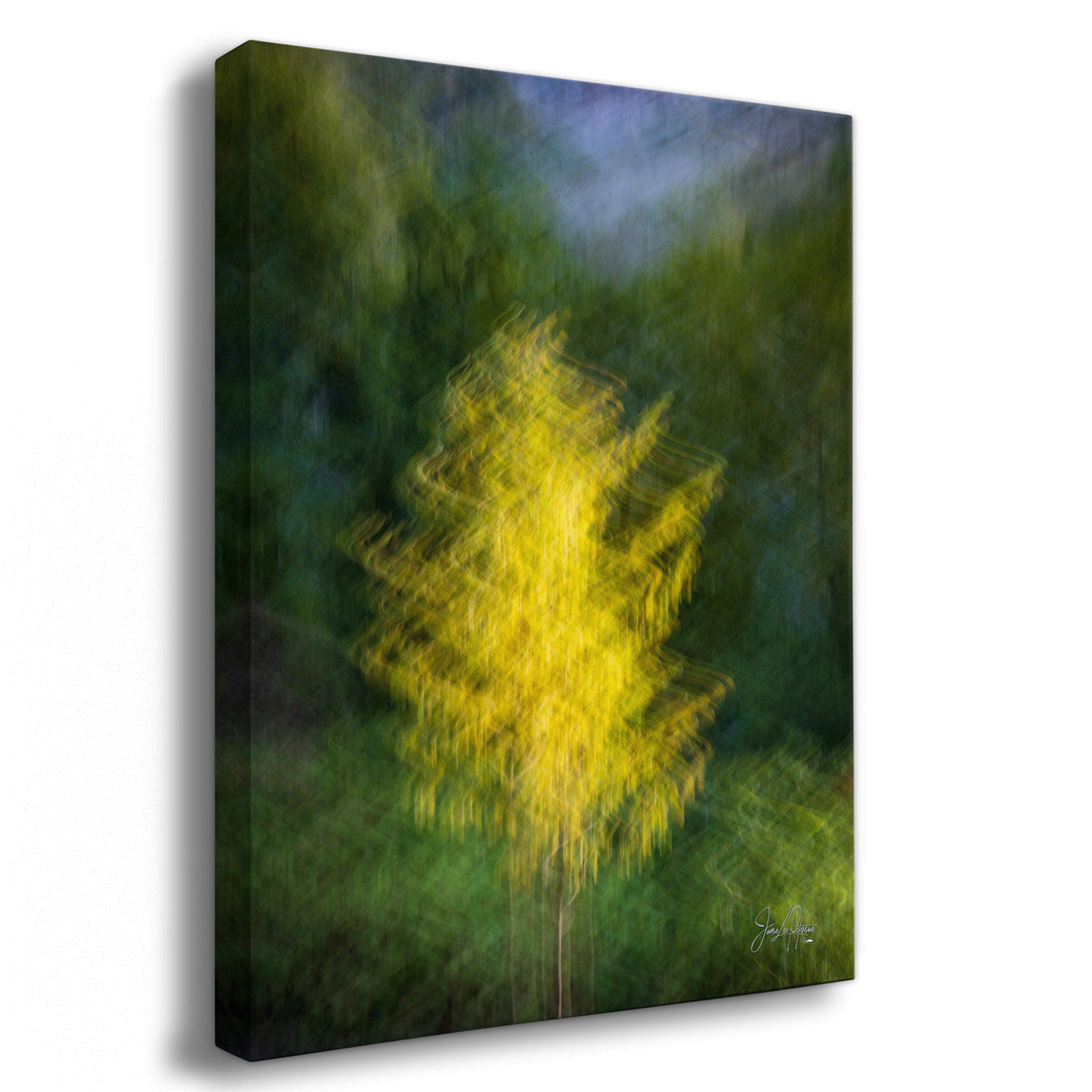 A vertical canvas wall art print featuring an abstract, painterly yellow tree against a dark green and blue background, shown at a three-quarter angle on a white studio background.