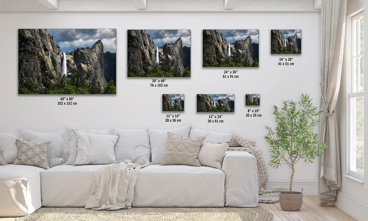 a living room filled with furniture and pictures on the wall