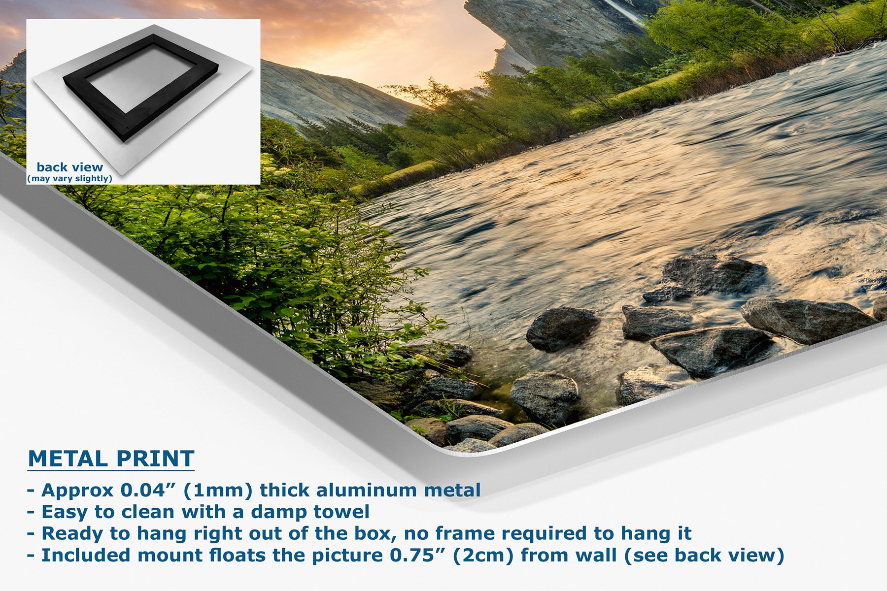 A metal wall art print showing a mountain stream scene with rocks, greenery, and warm sunset light, presented on a white background with product text and a small back-view inset.