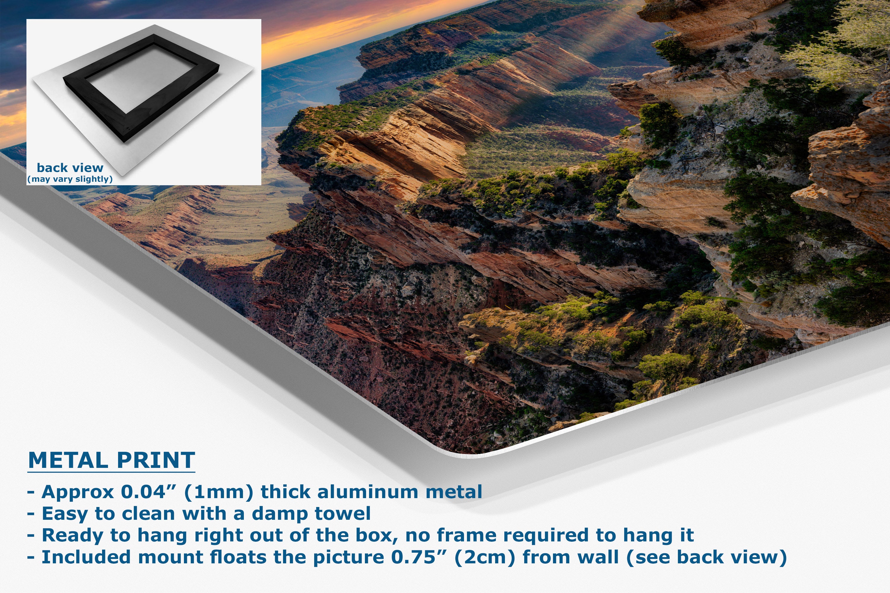 A large wall art print showing a canyon landscape, presented at an angle with a white mounting board visible along the left edge. A small inset shows the back view of the product.