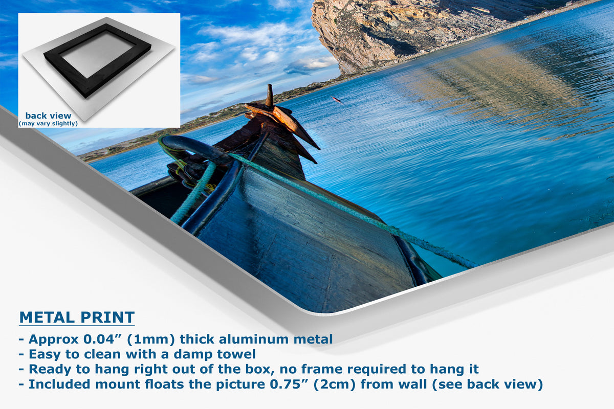 Metal print of a scenic landscape with a boat on water, featuring text about metal print properties.